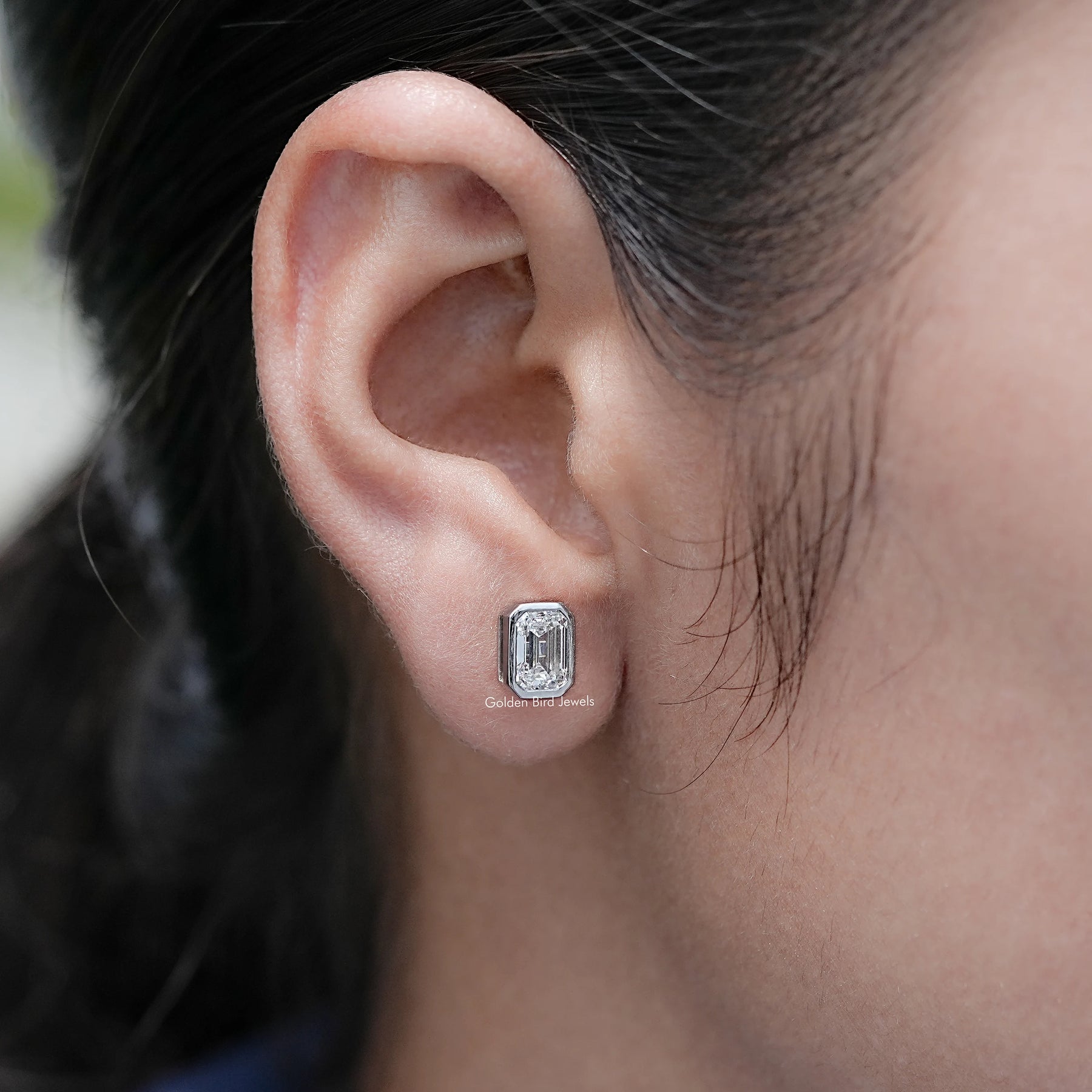 Side View of Emerald Cut Lab Diamond Stud Earrings On Ear