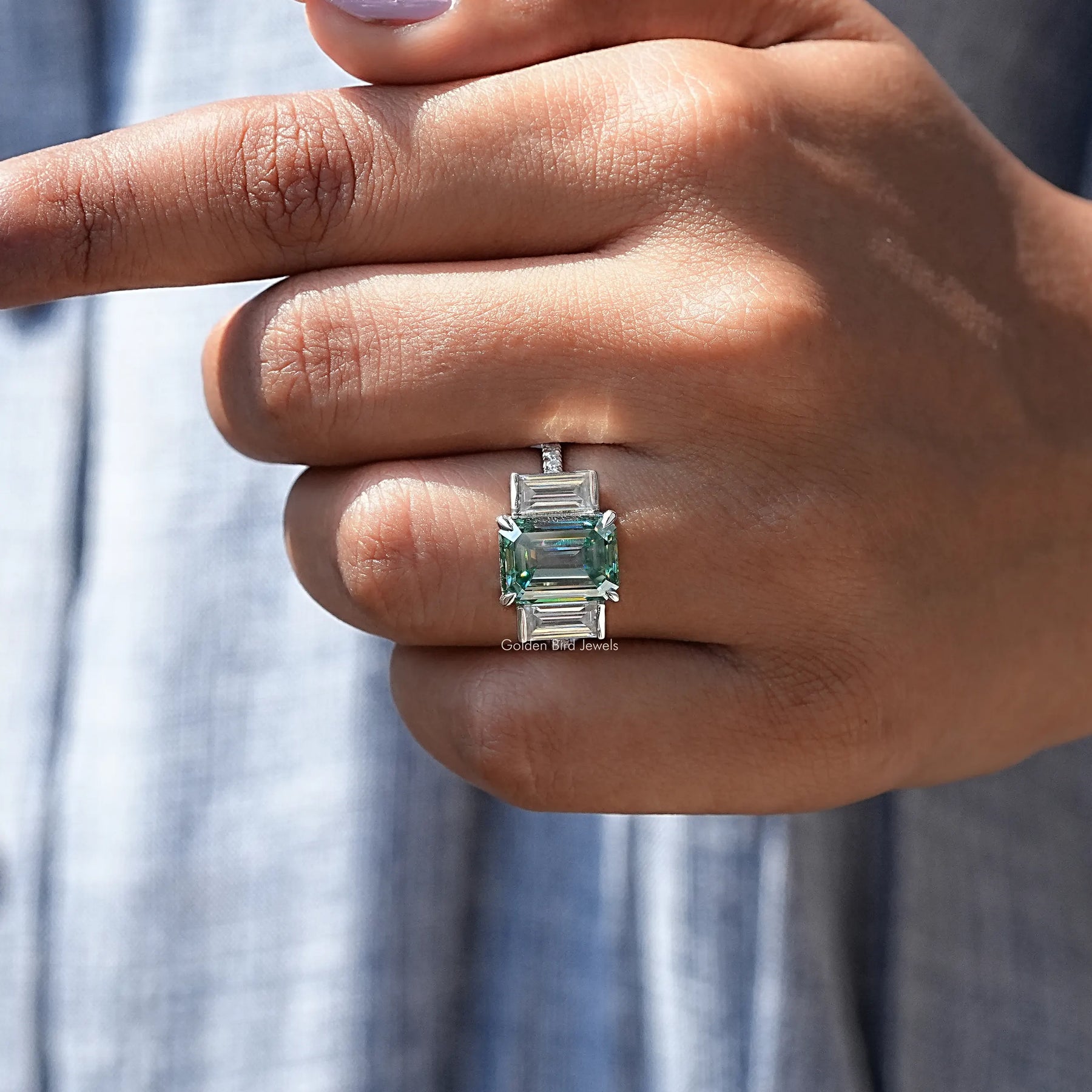 Profile View of Emerald Cut Three Stone Engagement Ring