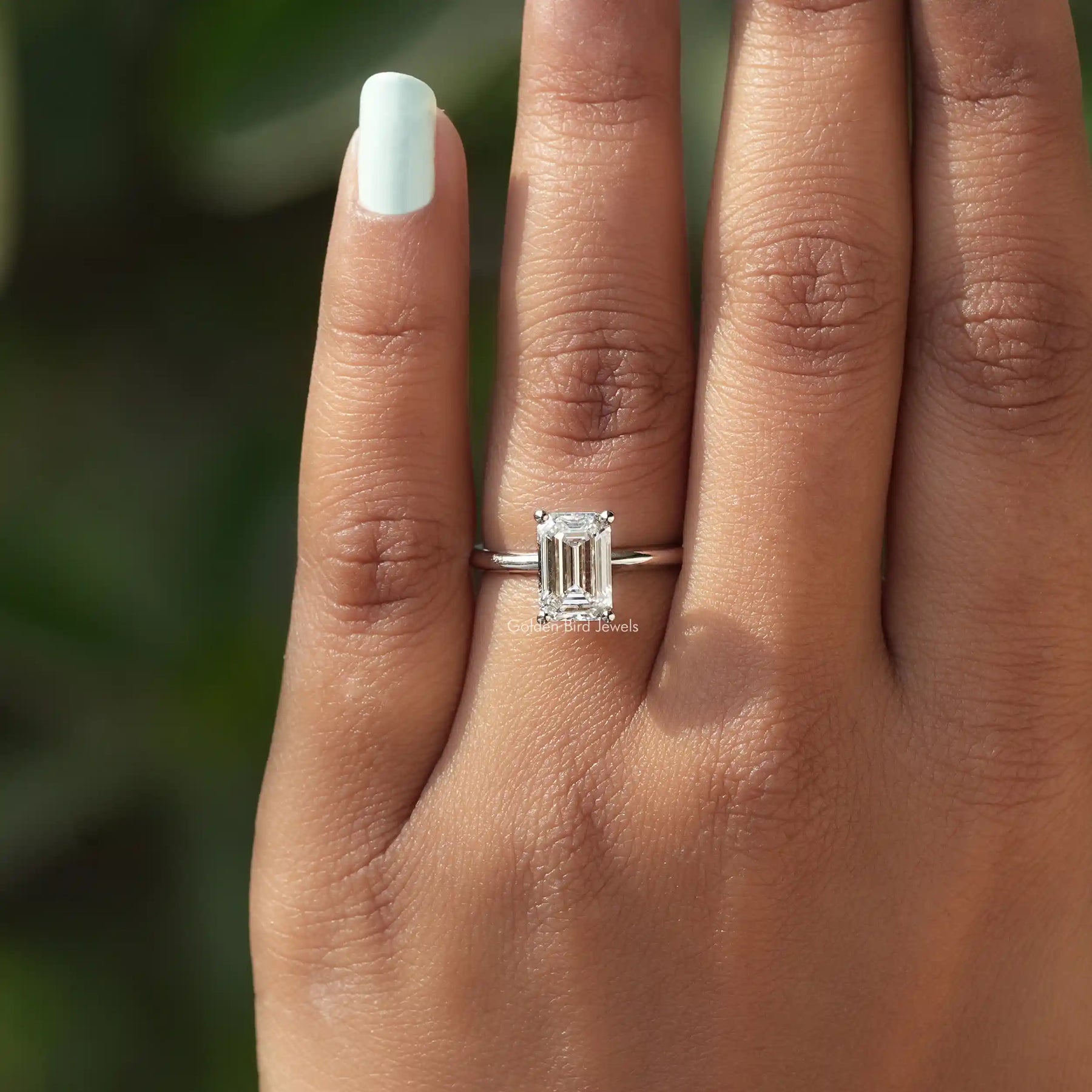 View of Emerald Cut Diamond Solitaire Ring In finger