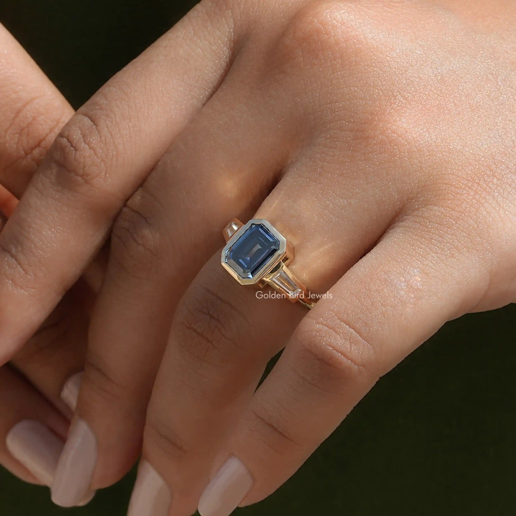View of Emerald Moissanite Bezel Set Ring In Finger