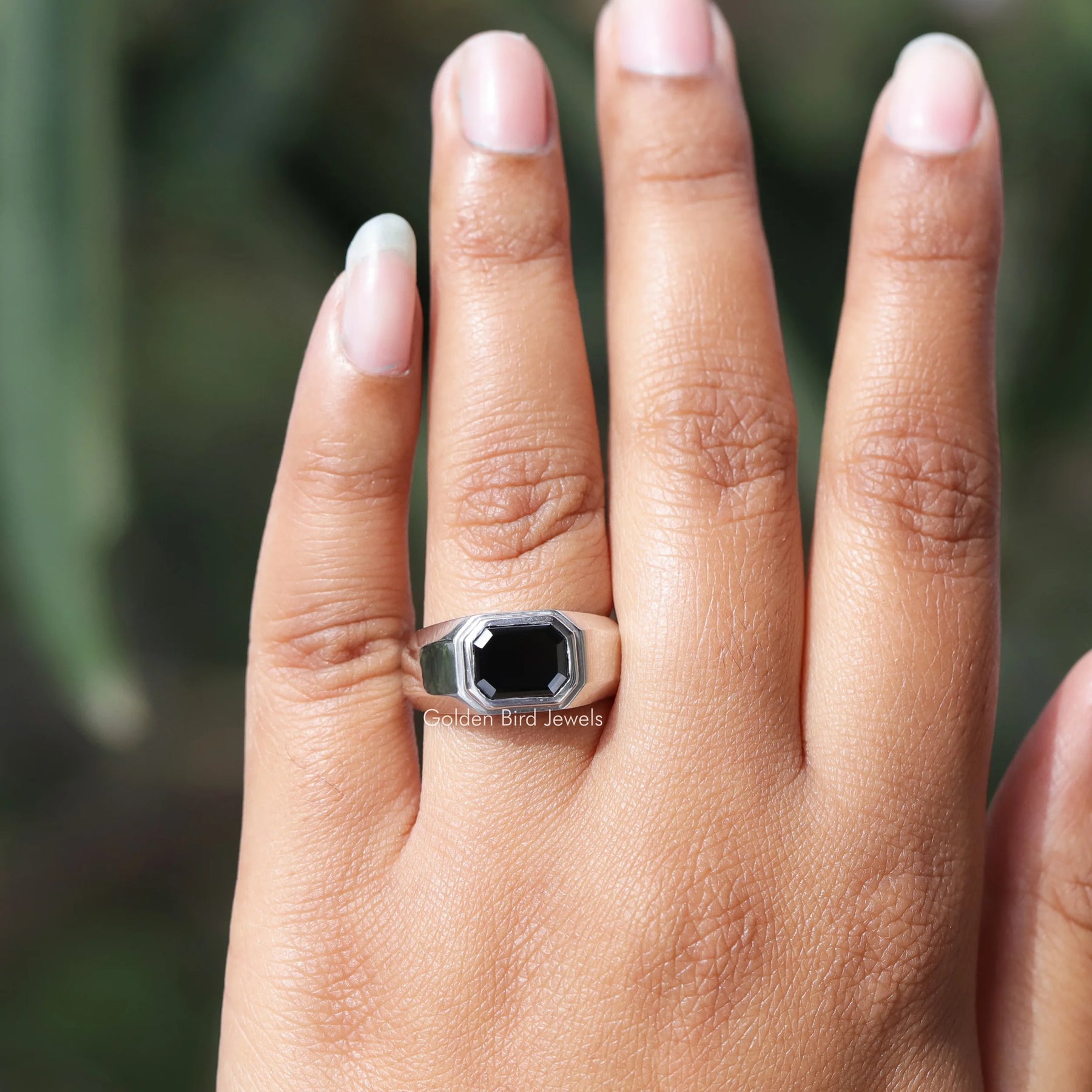 In hand showing view of moissanite Ring