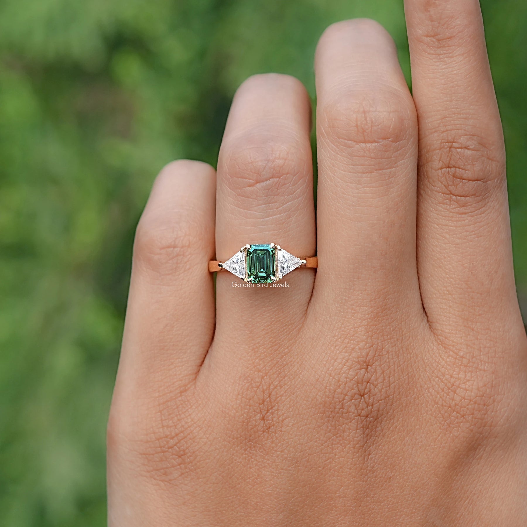 Emerald And Triangle Moissanite Three Stone Ring