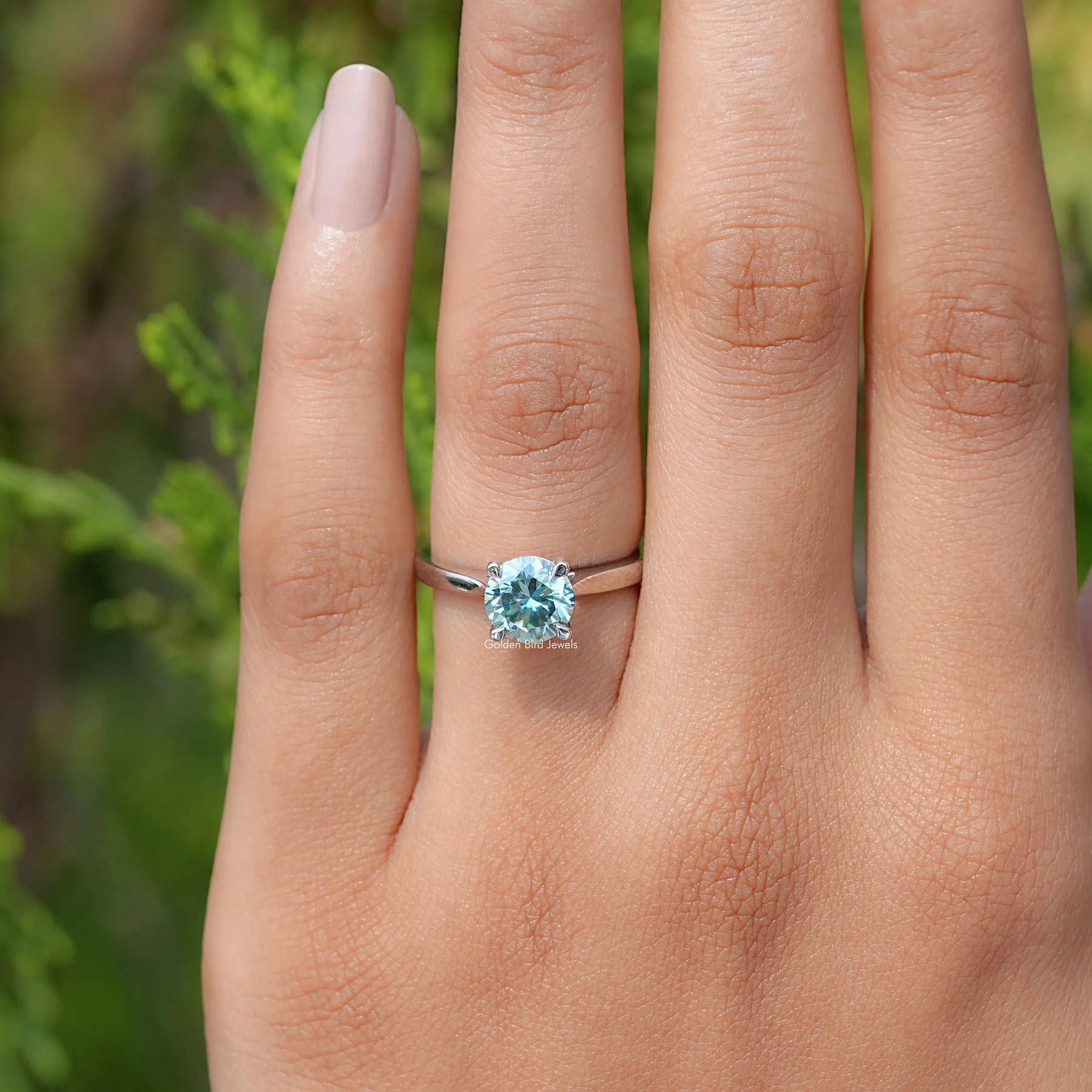 View of Blue Green Round moissanite Solitaire Ring