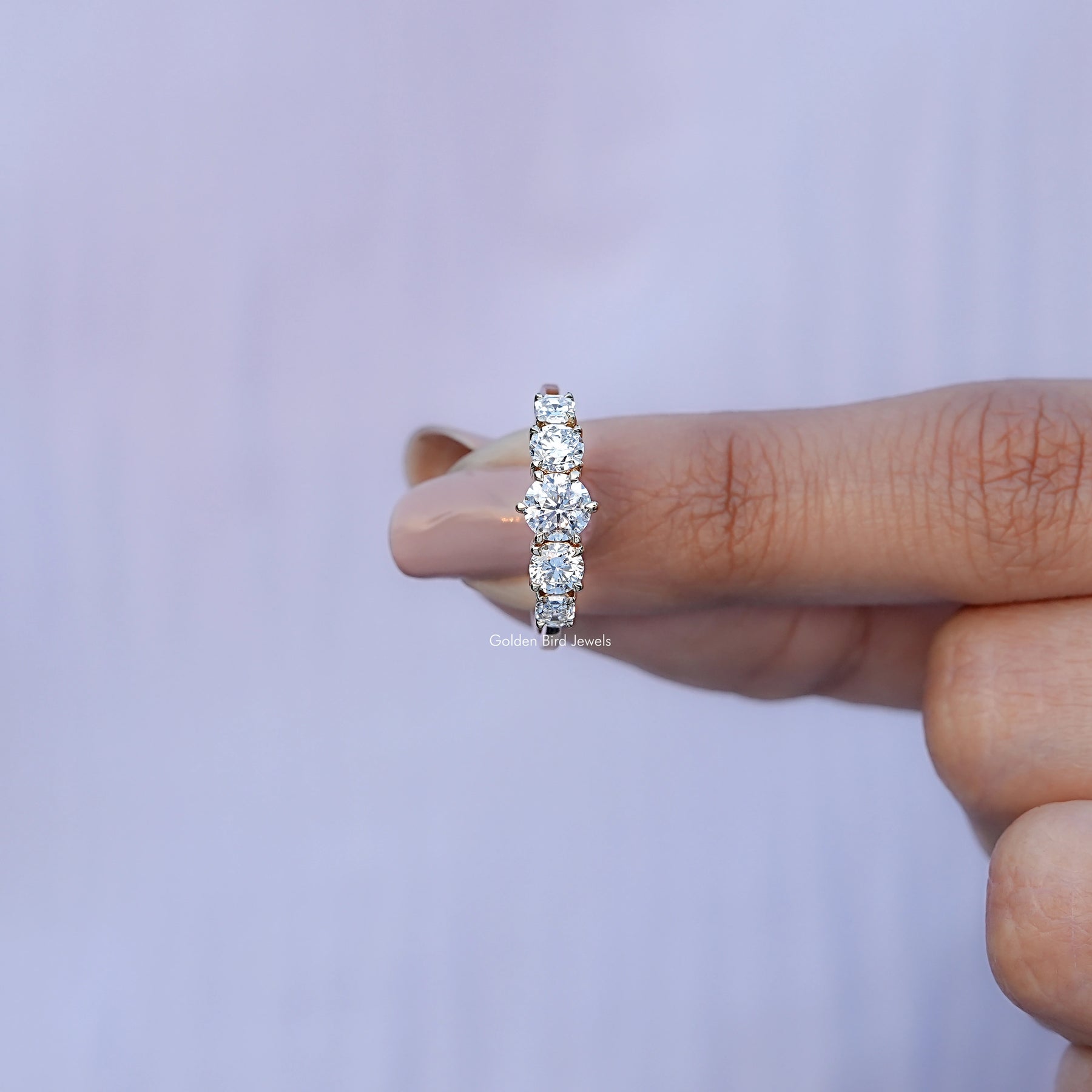 In finger front View of Octagon And Round Cut Lab Diamond Ring In Yellow Gold