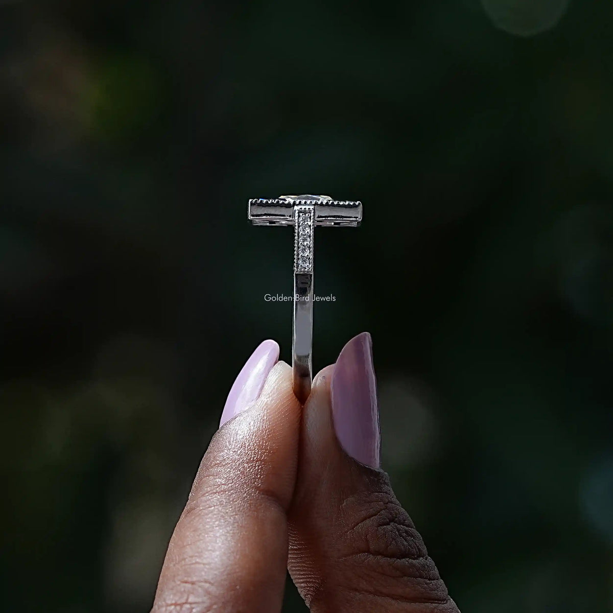 Side View of French Radiant Cut Moissanite Ring In two fingers