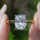 Elongated Old Mine Cushion Lab Diamond Hidden Halo Ring Held Between Fingers