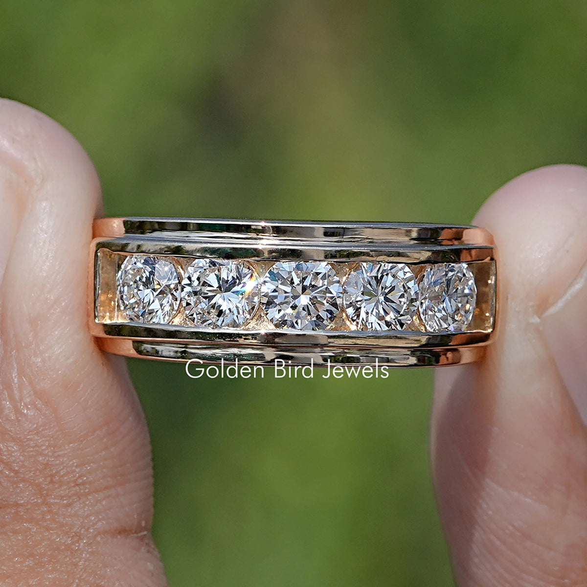 Round Cut Lab Diamond Channel Set Men’s Ring Held Between Fingers