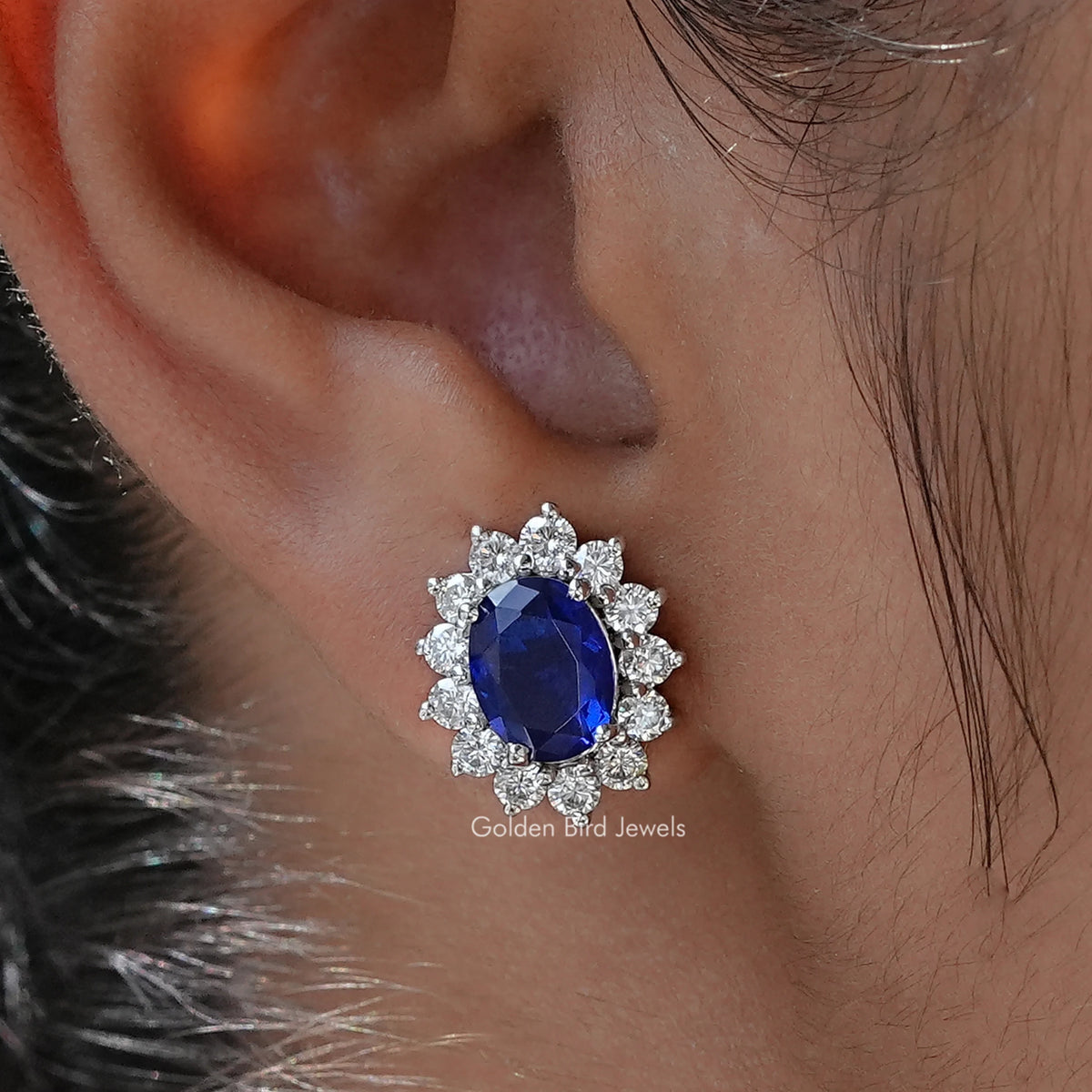 Close Up View of Oval Blue Gemstone Halo Stud Earrings