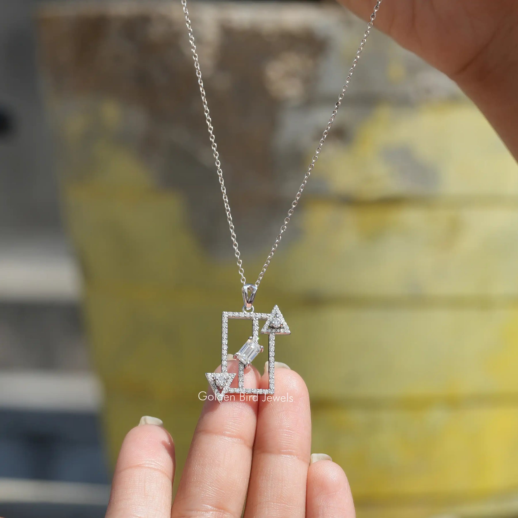 Front view of emerald cut moissanite pendant