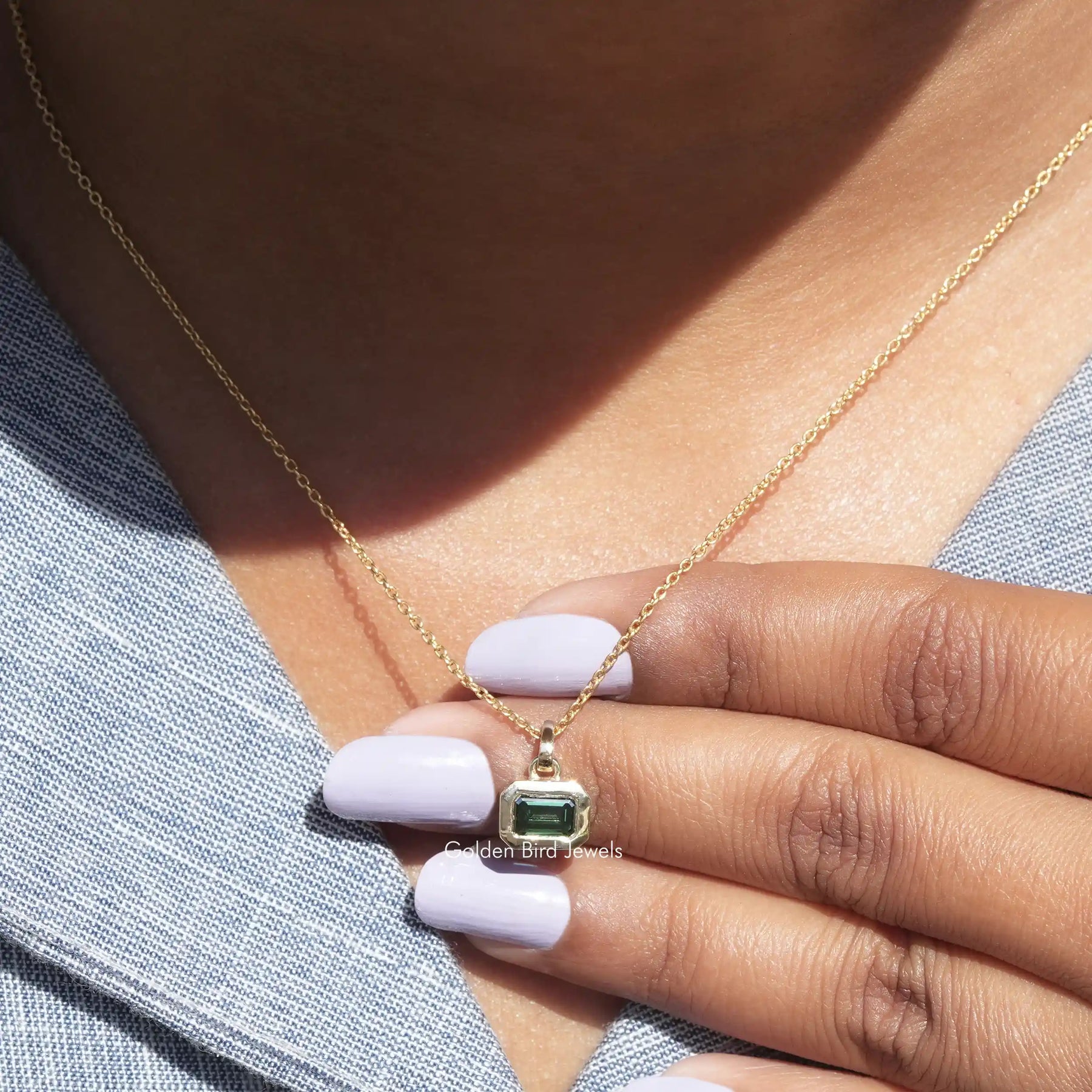 In front view of moissanite emerald cut pendant