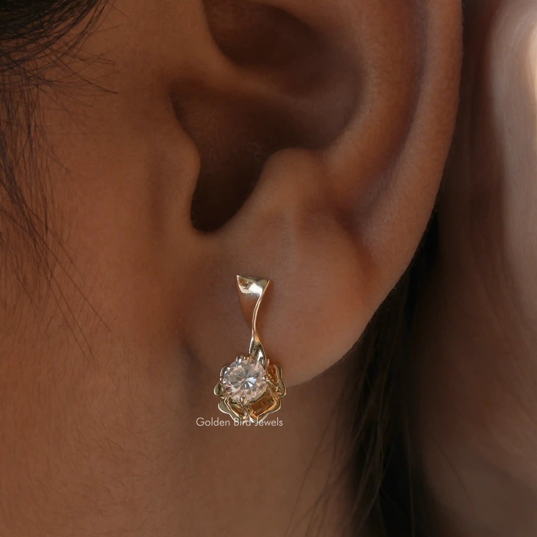 Side view of round cut cluster moissanite earrings
