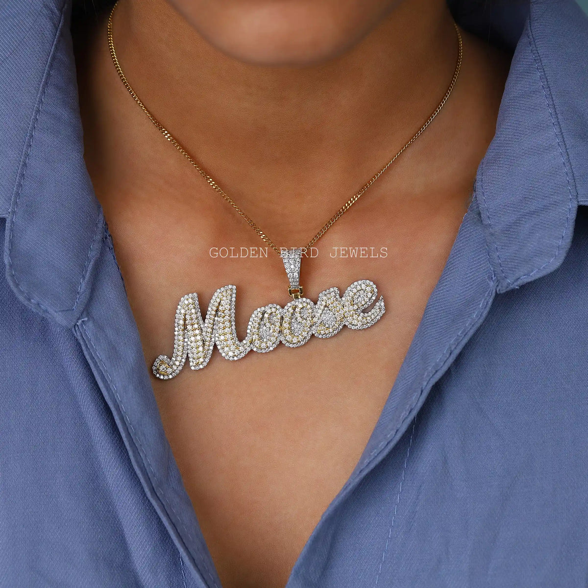 In neck front view of round cut letter pendant
