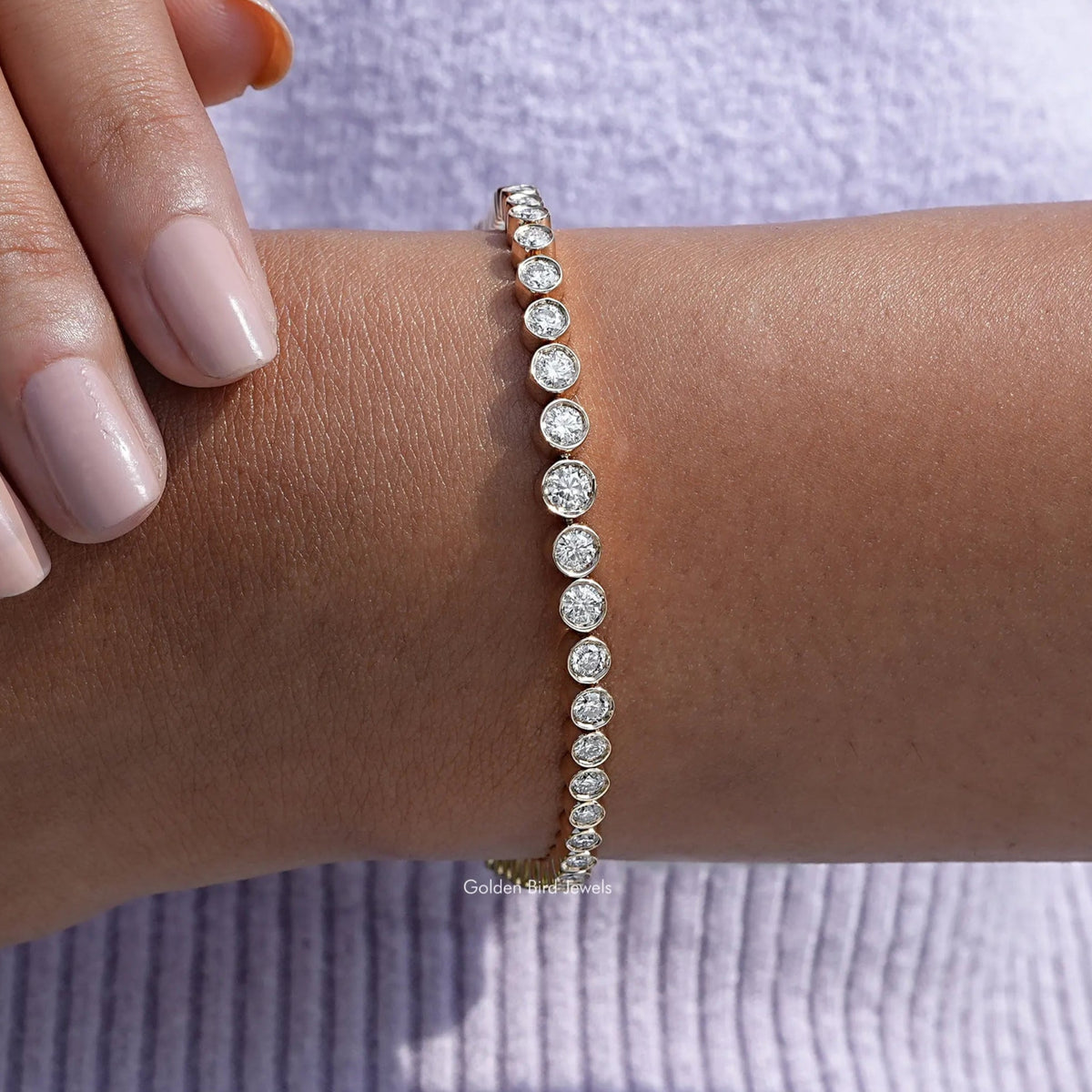 View of Graduated Round Cut Moissanite Tennis Bracelet