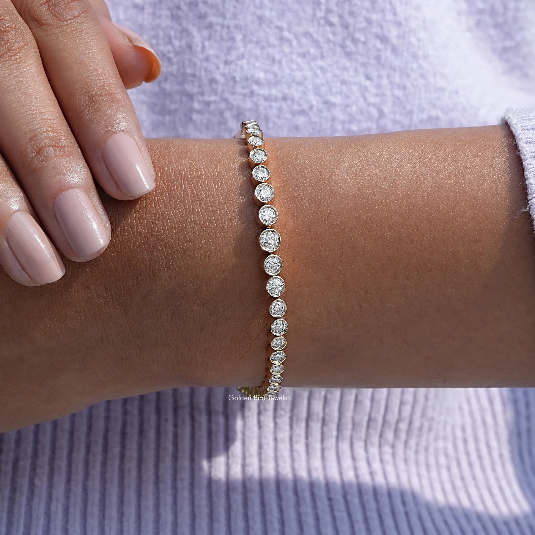 View of Graduated Round Cut Moissanite Tennis Bracelet