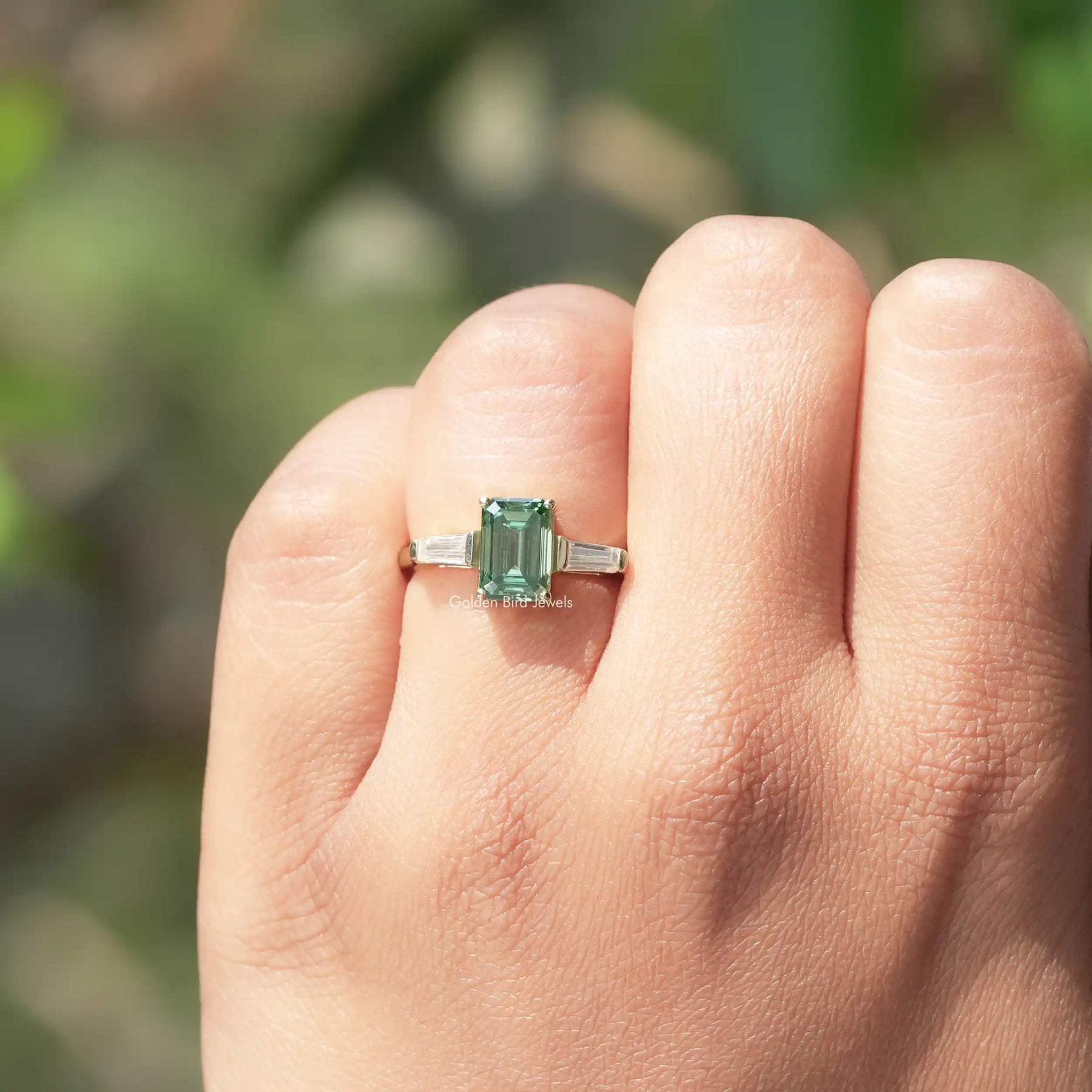 Detailed View Of Emerald And Tapper Baguette Cut Moissanite Ring In Yellow Gold