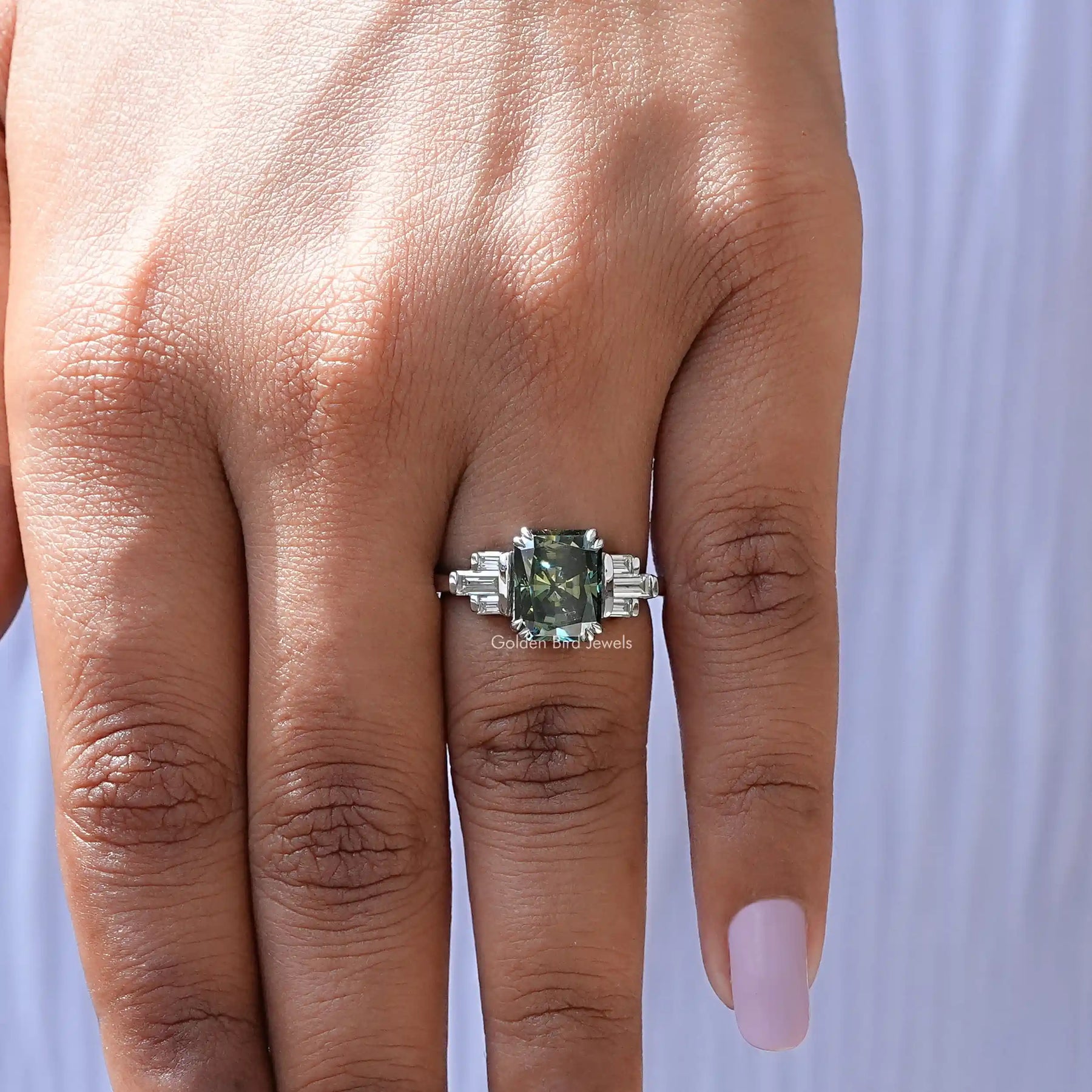Green Radiant Cut White Gold Engagement Ring In finger