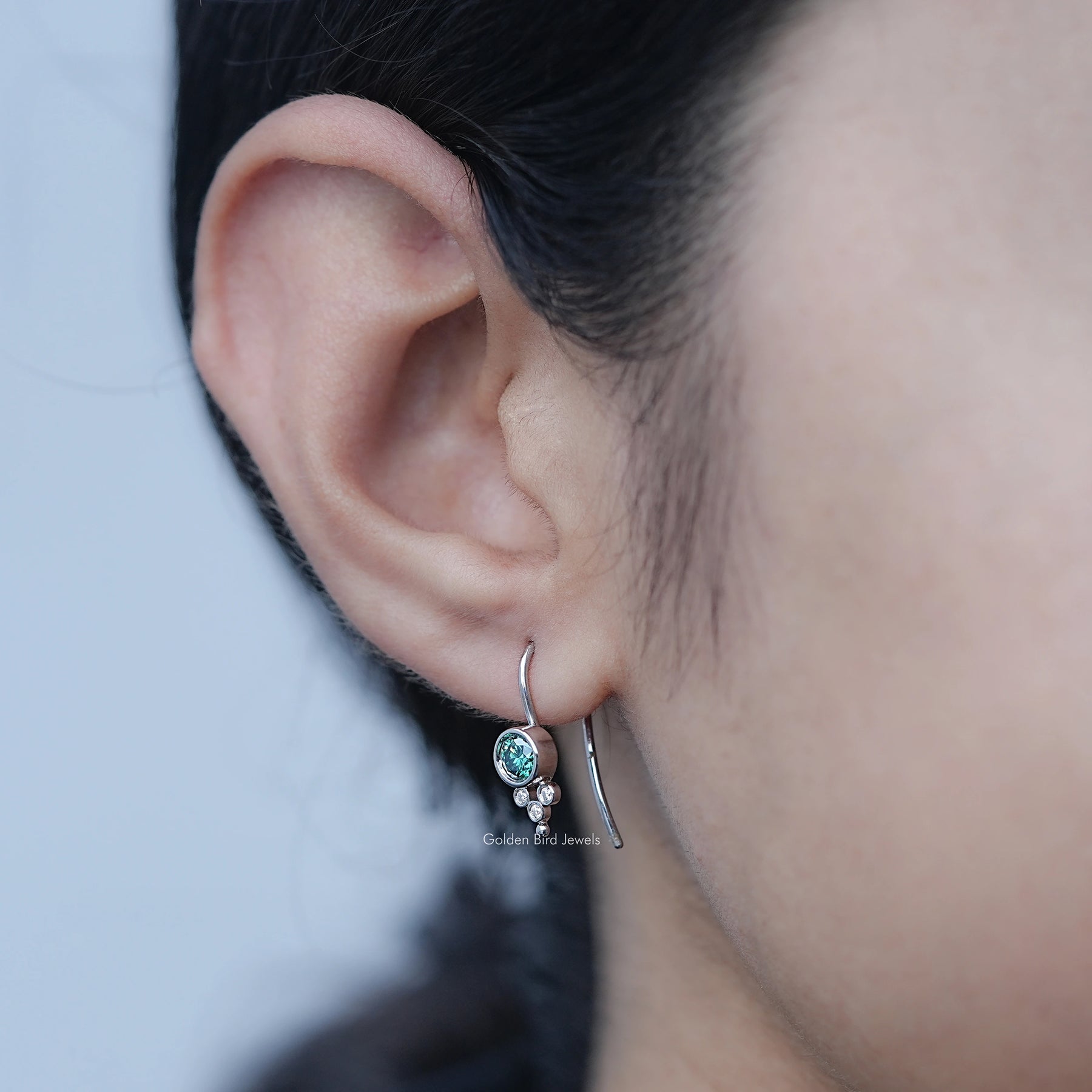 Front view of Green Round Moissanite Earwire Drop Earrings