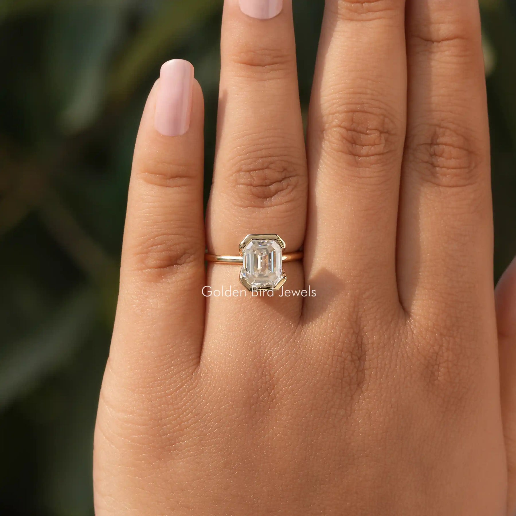 Detailed View of Emerald Cut Moissanite Engagement Ring In Yellow Gold