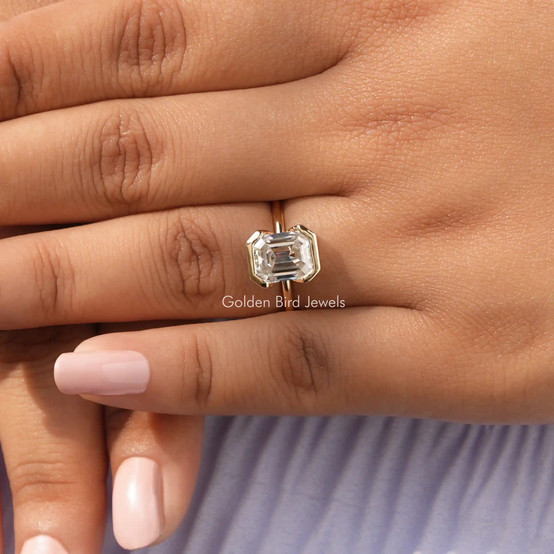 View of Emerald Cut Solitaire Moissanite Ring Engagement Ring In Finger