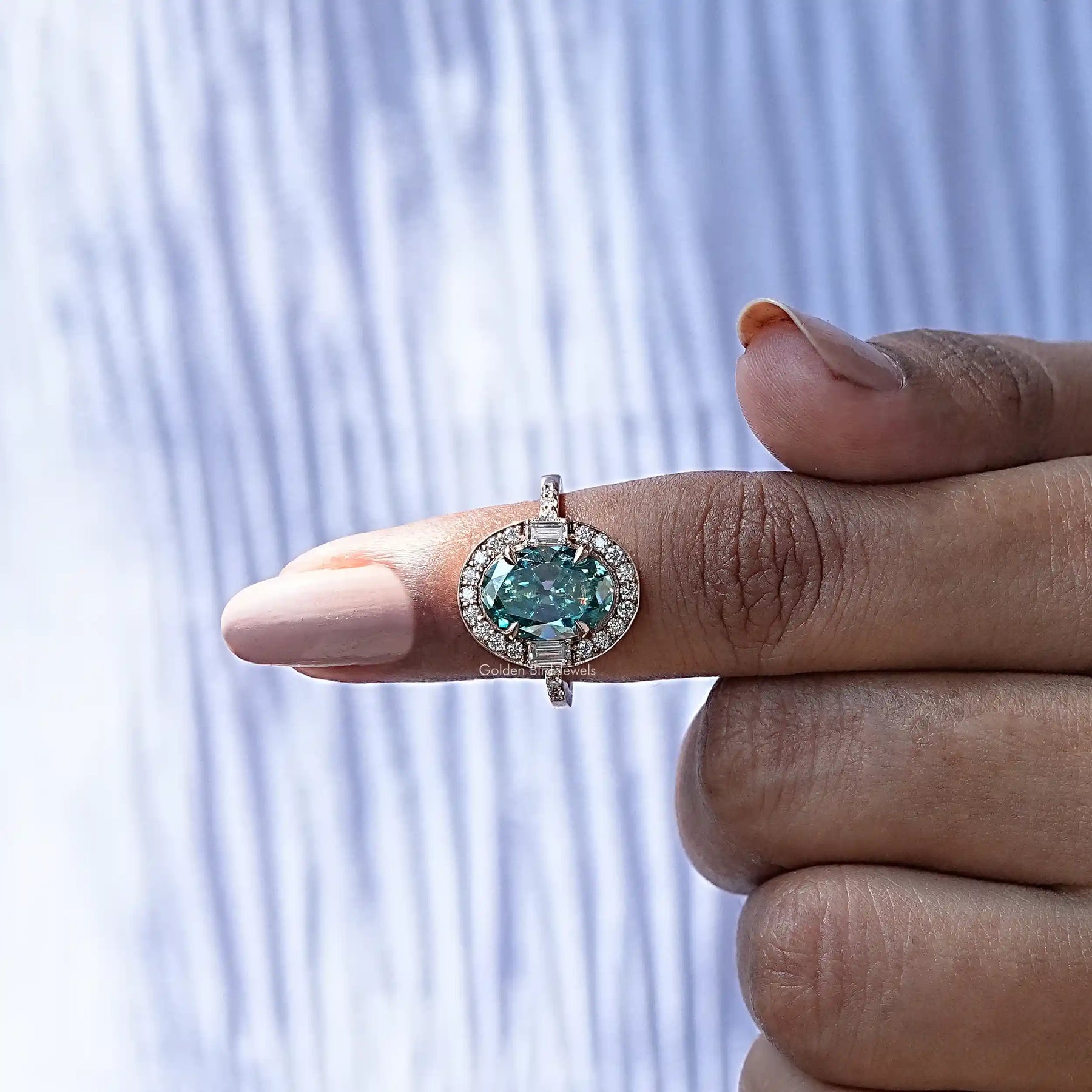 In finger front View of Round And Baguette Cut Moissanite Engagement Ring In Yellow Gold