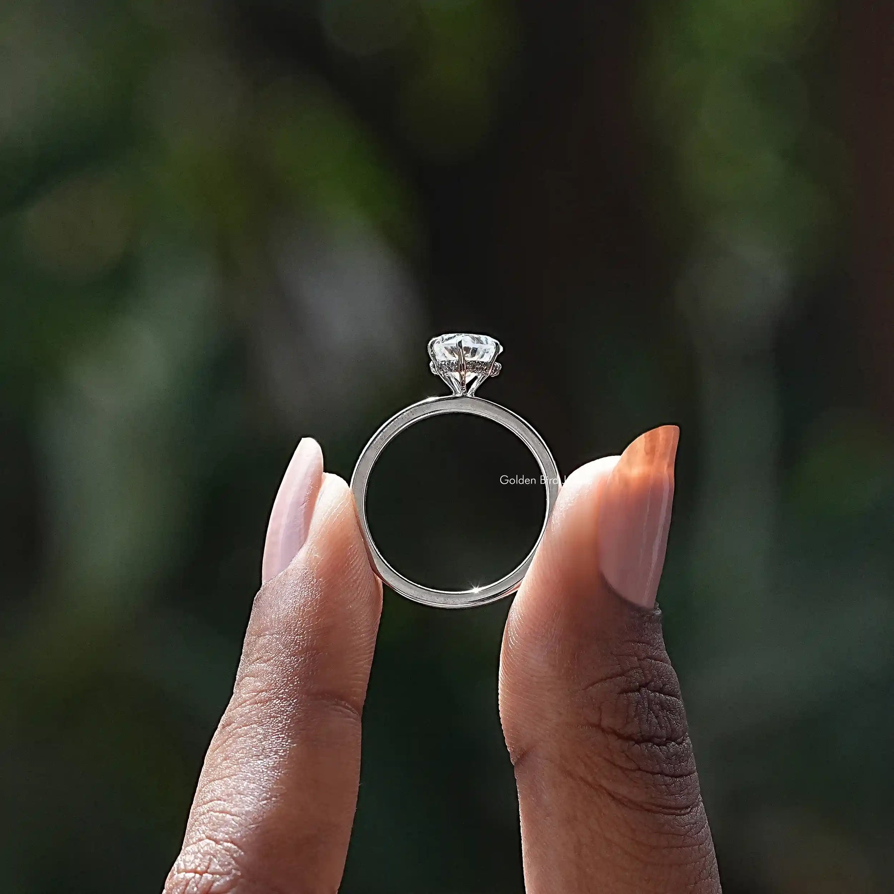 Back View of Heart Cut Moissanite Ring In two fingers