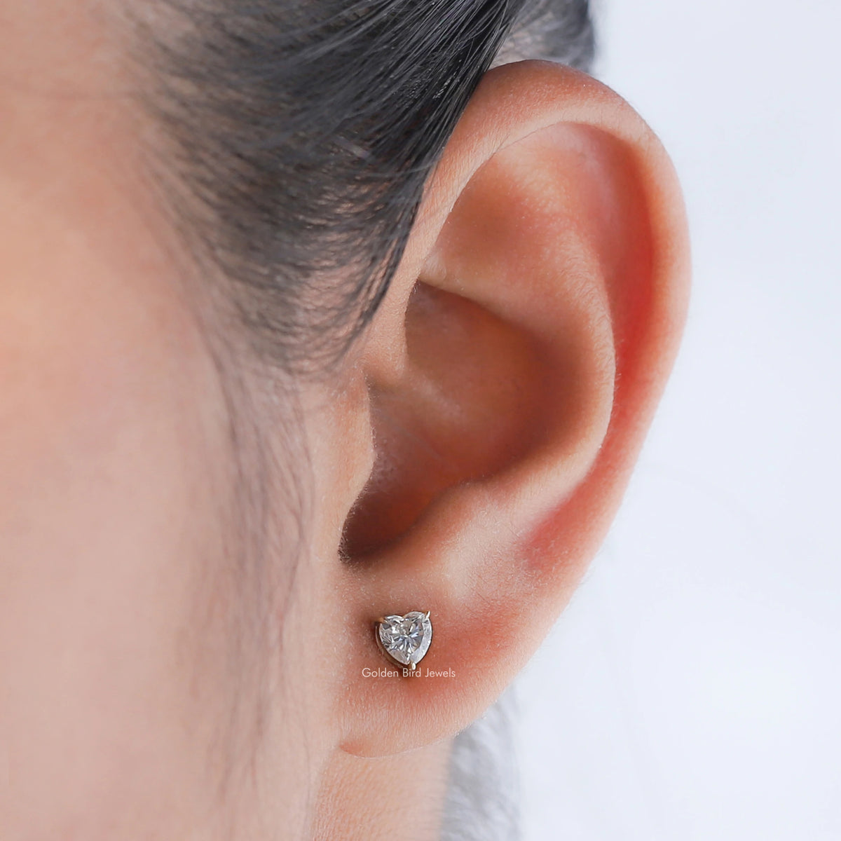 In ear view of moissanite earrings in prongs setting