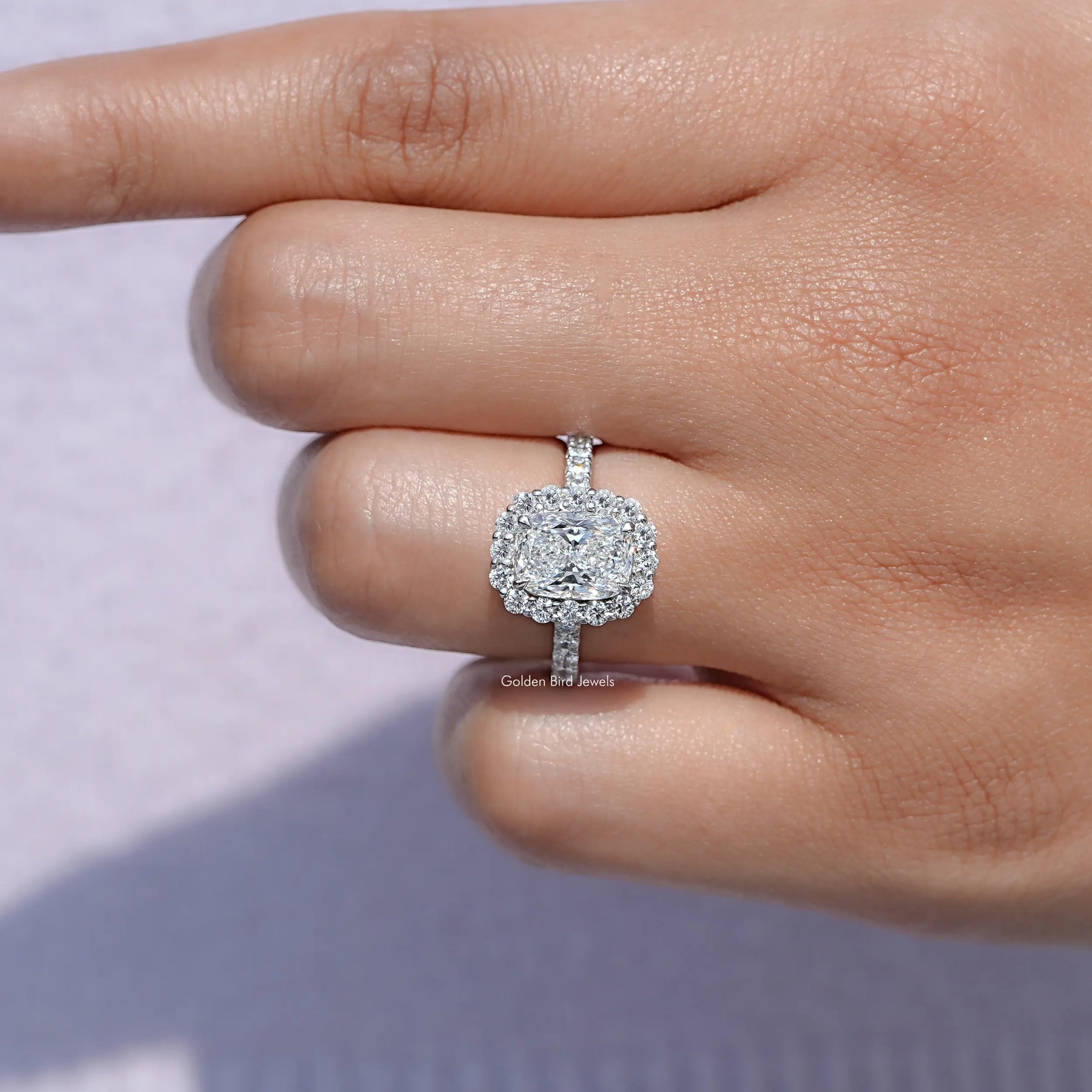 View of Lab Diamond Halo Accent Engagement Ring in prongs setting