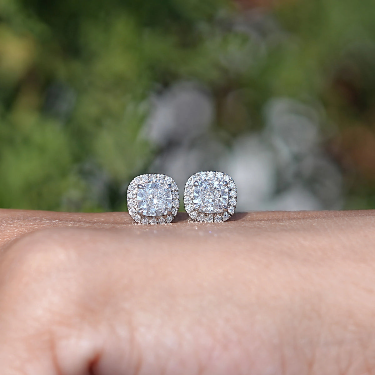 In Hand View Of Cushion Cut Diamond Stud Earring In White Gold