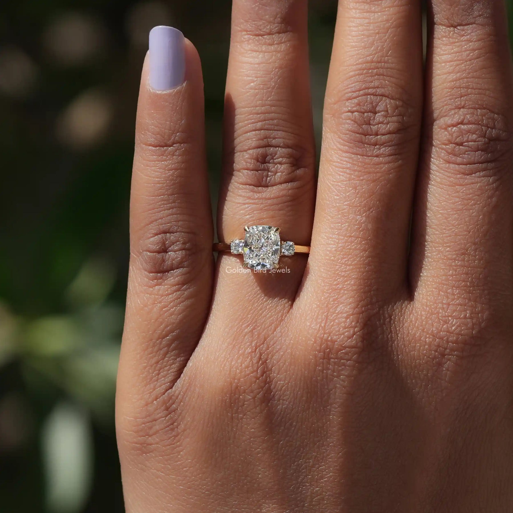 Close-Up View of Lab Diamond Cushion Cut Three Stone Ring