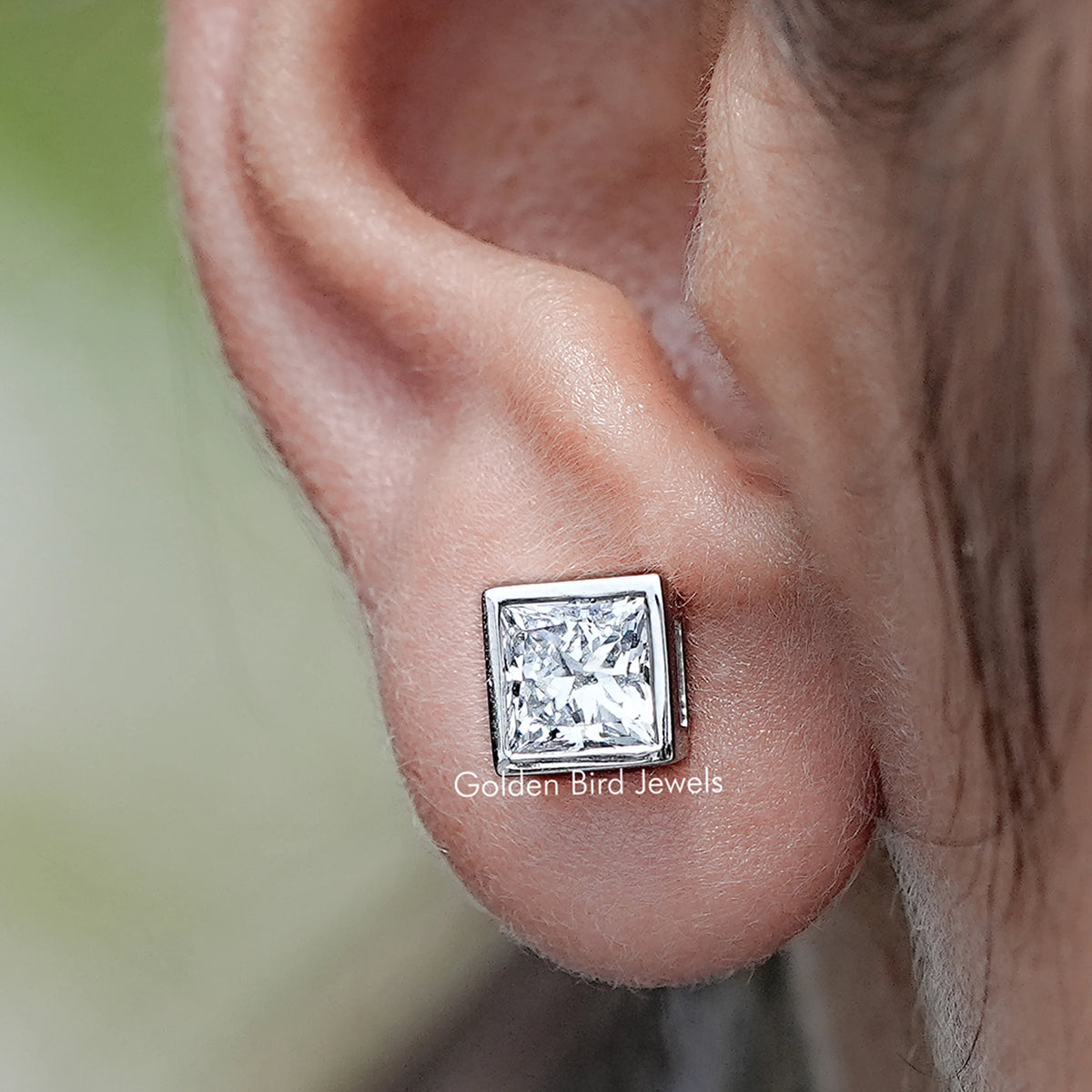 Close up view of Bezel Set Princess Lab Diamond Stud Earrings