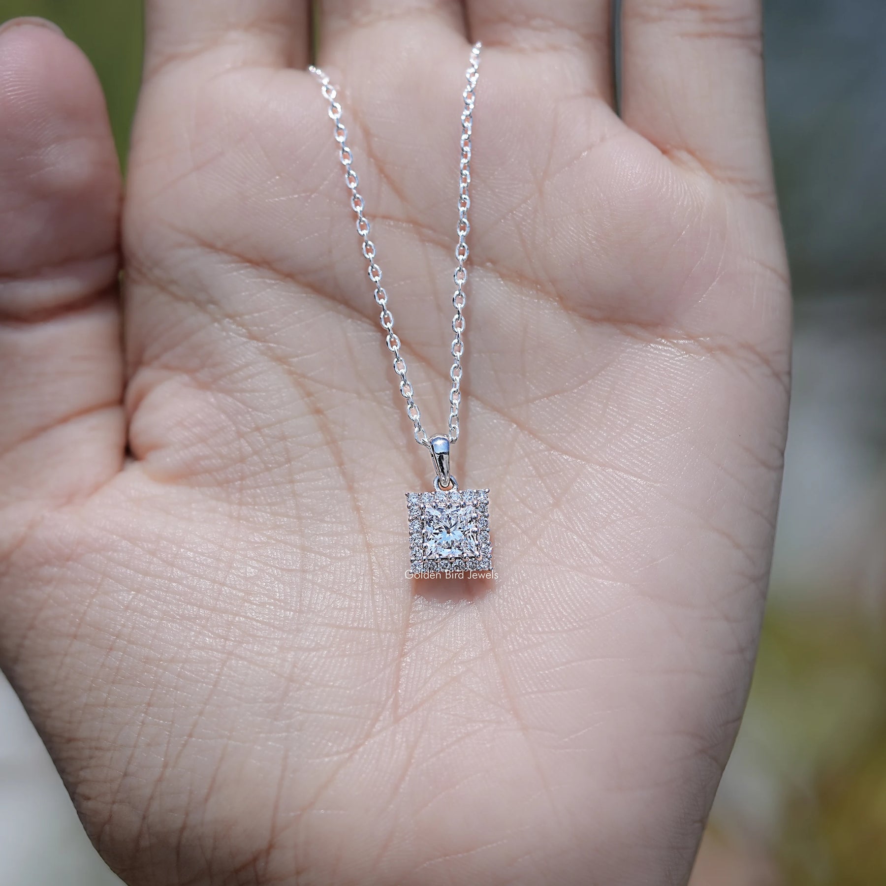 In Hand Showing of Princess Cut Lab Diamond Halo Pendant