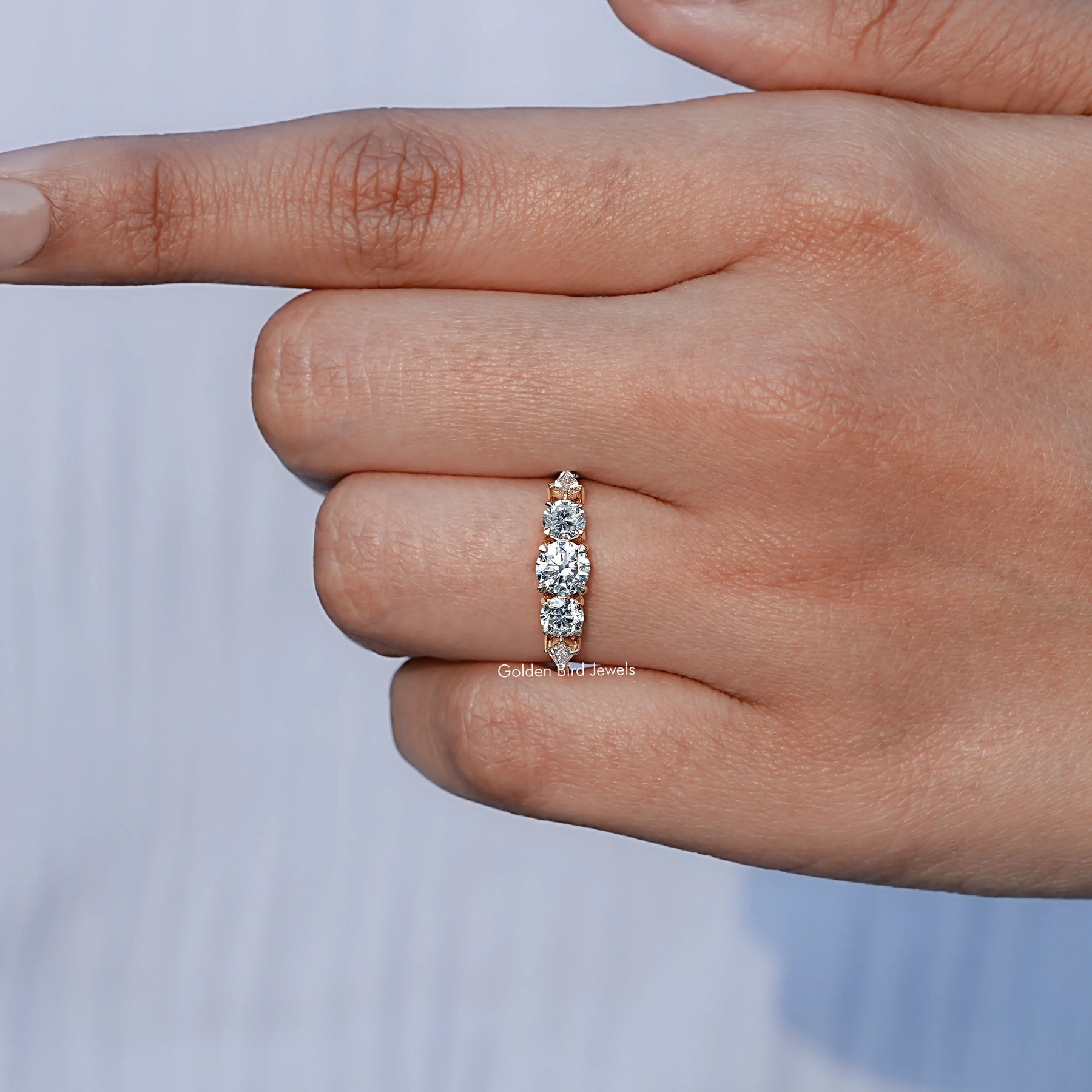 Close-Up View of Lab Diamond Kite And Round 5 Stone Ring In Yellow Gold
