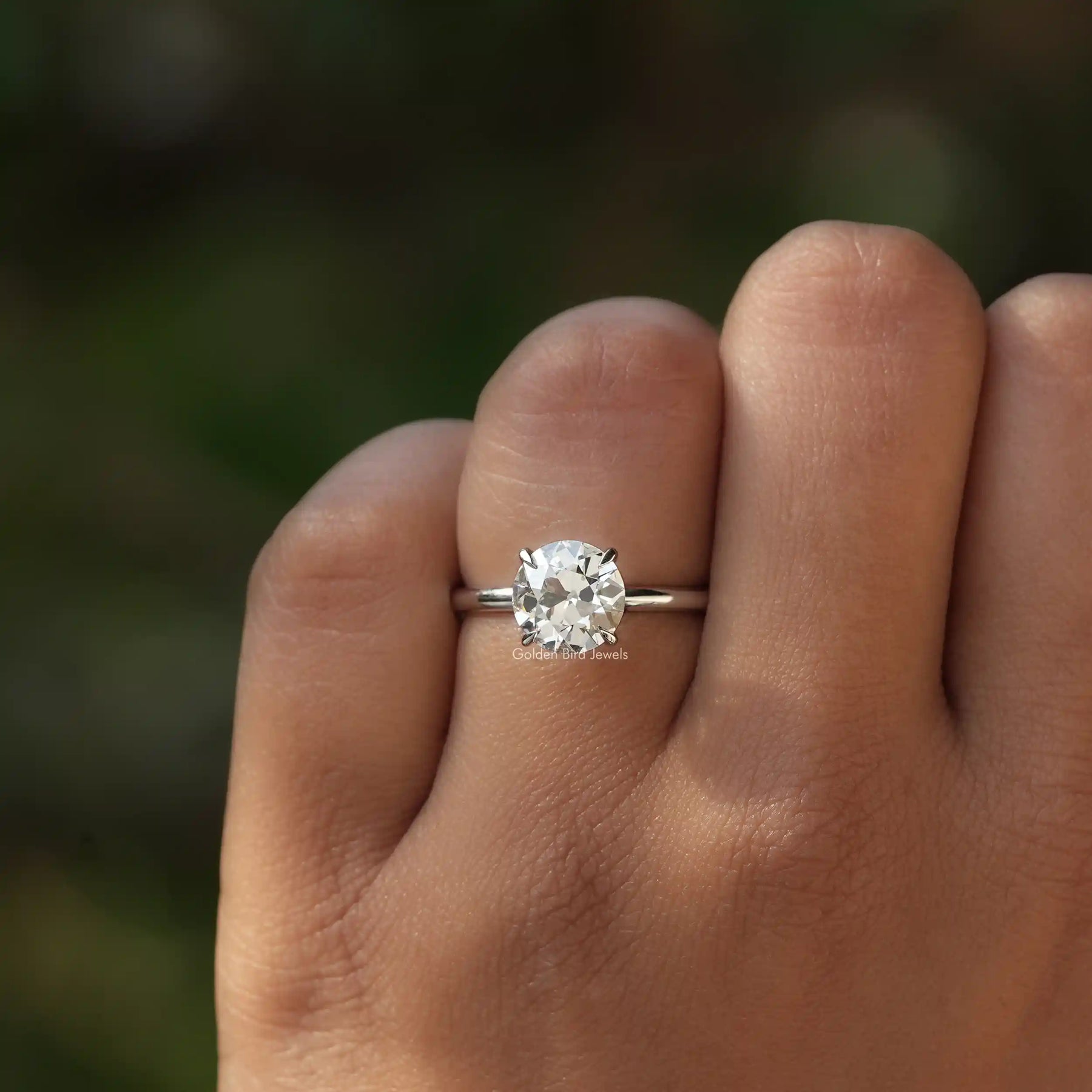 View of Old European Round Cut Solitaire Engagement Ring In finger