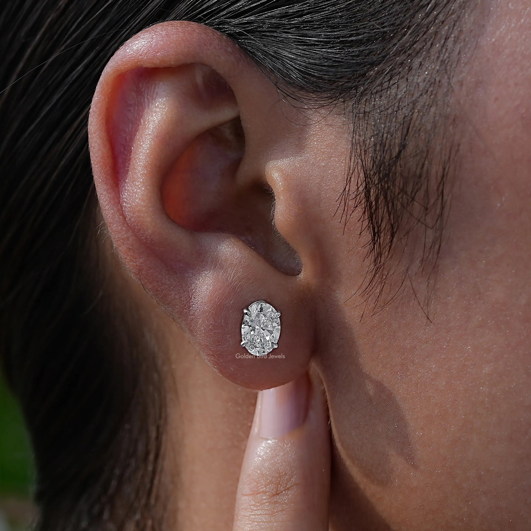 In Ear View Of diamond Earrings in four prongs setting