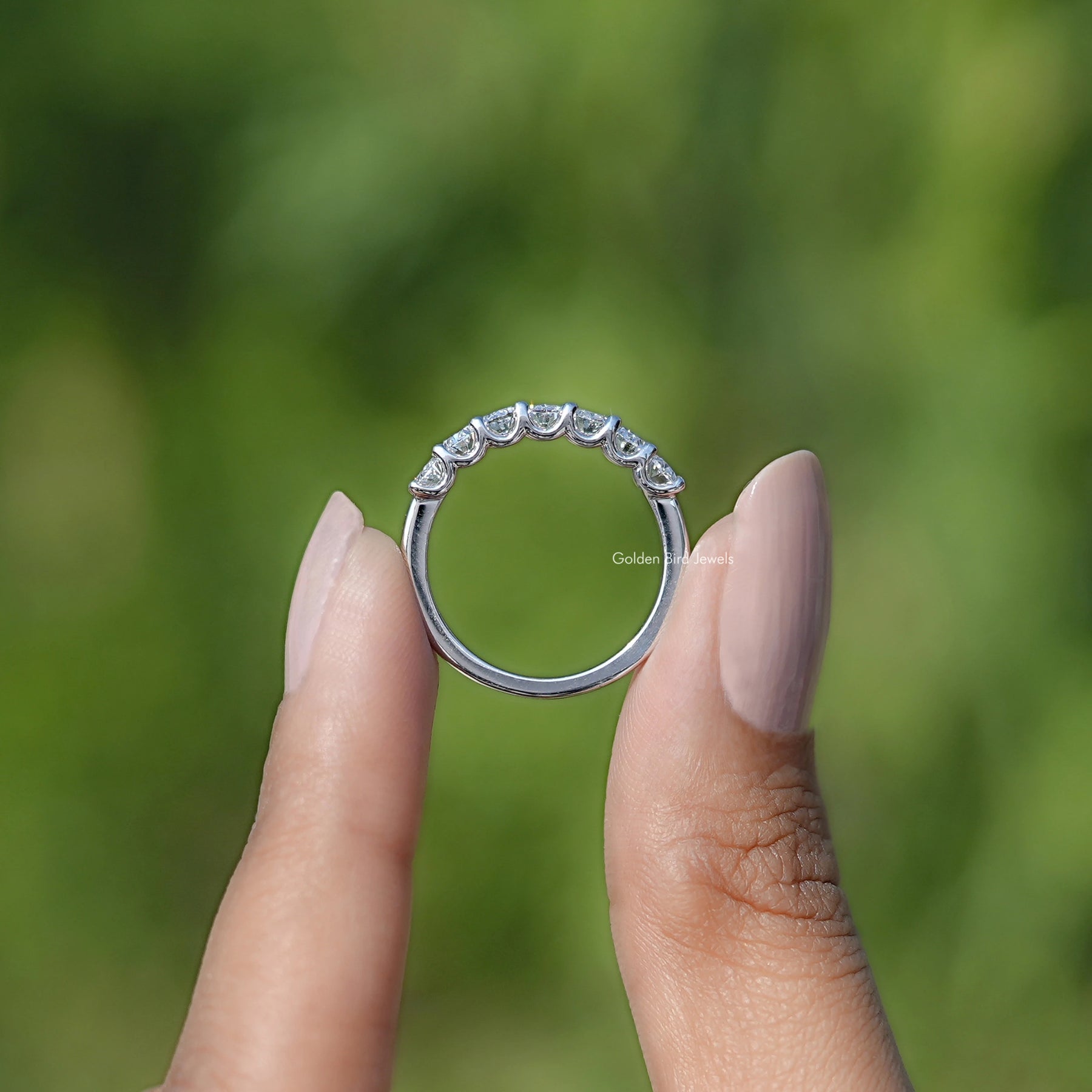 Back view of Oval Seven Stone Wedding Band in secure setting