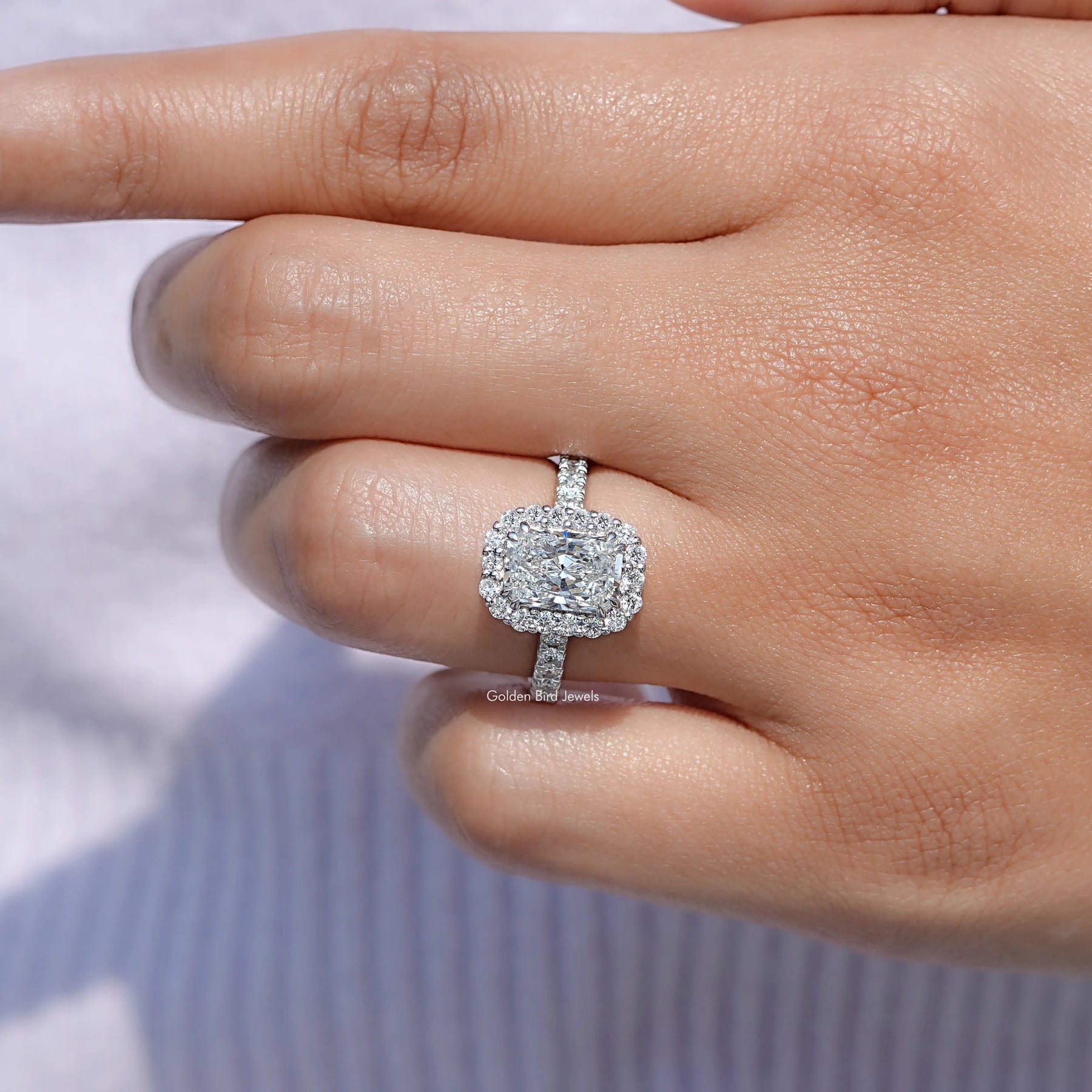 In finger front view of Lab Diamond Halo Accent Engagement Ring in unique shape