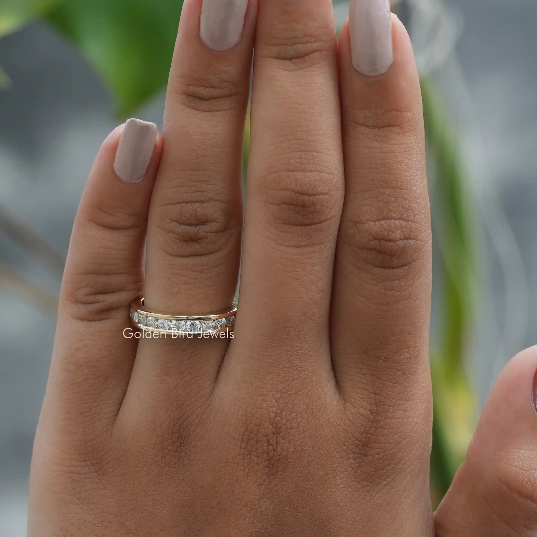 View of Round Cut Half Channel Set Wedding Band In Finger