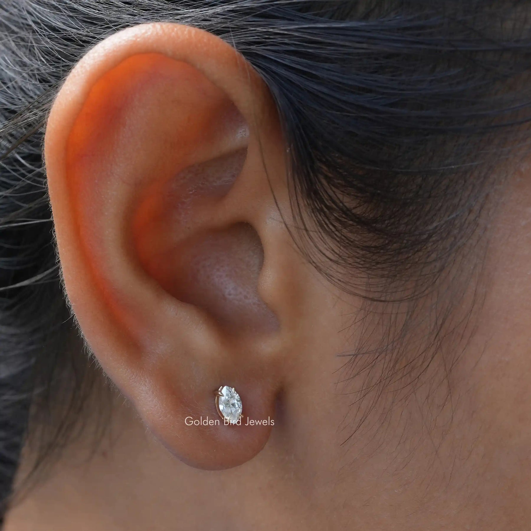 This moissanite earrings crafted with yellow gold and prong setting