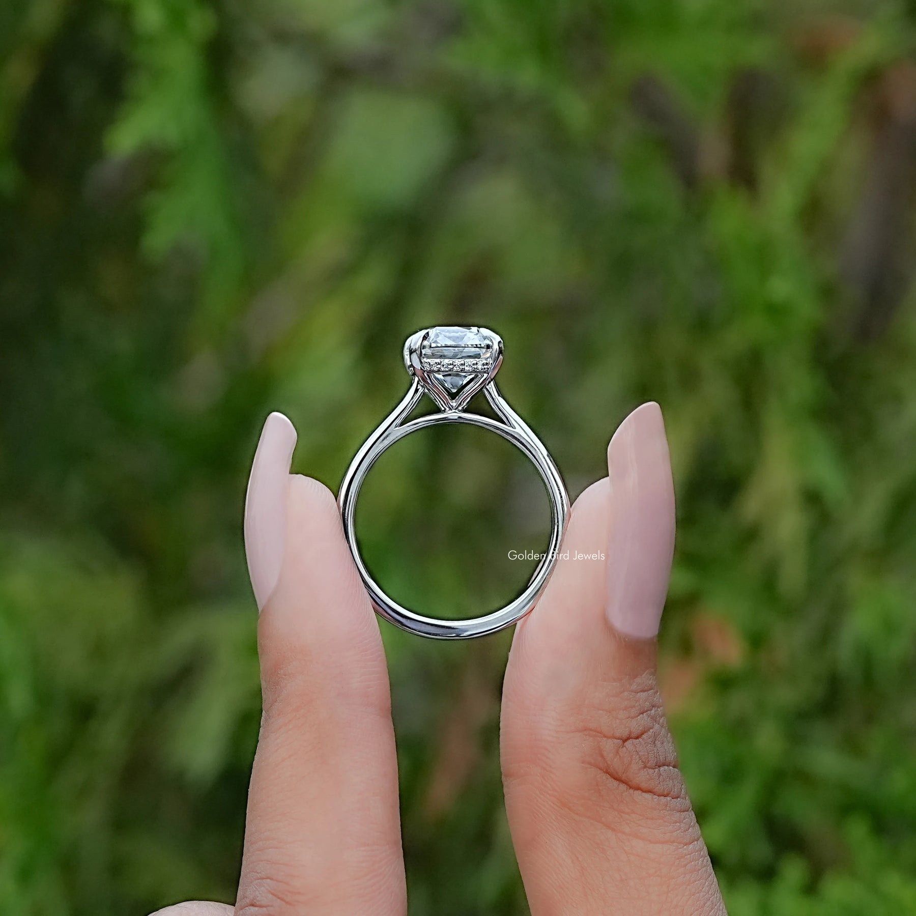 Back View of Old Mine Elongated Cushion Cut Diamond Ring In two fingers
