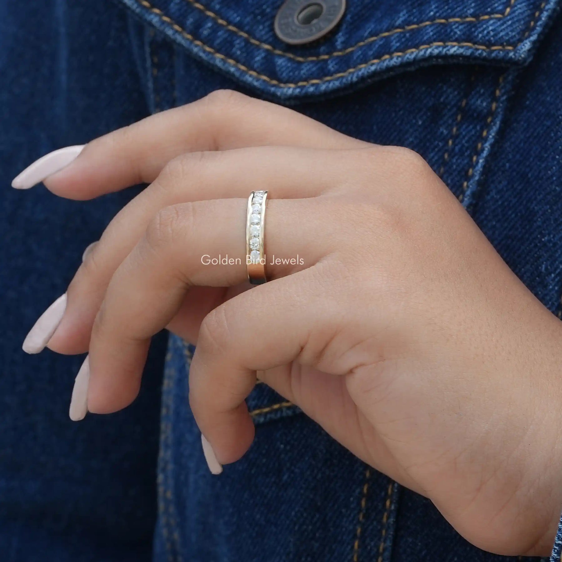 Side View of Round Cut Half Channel Set Wedding Band In finger