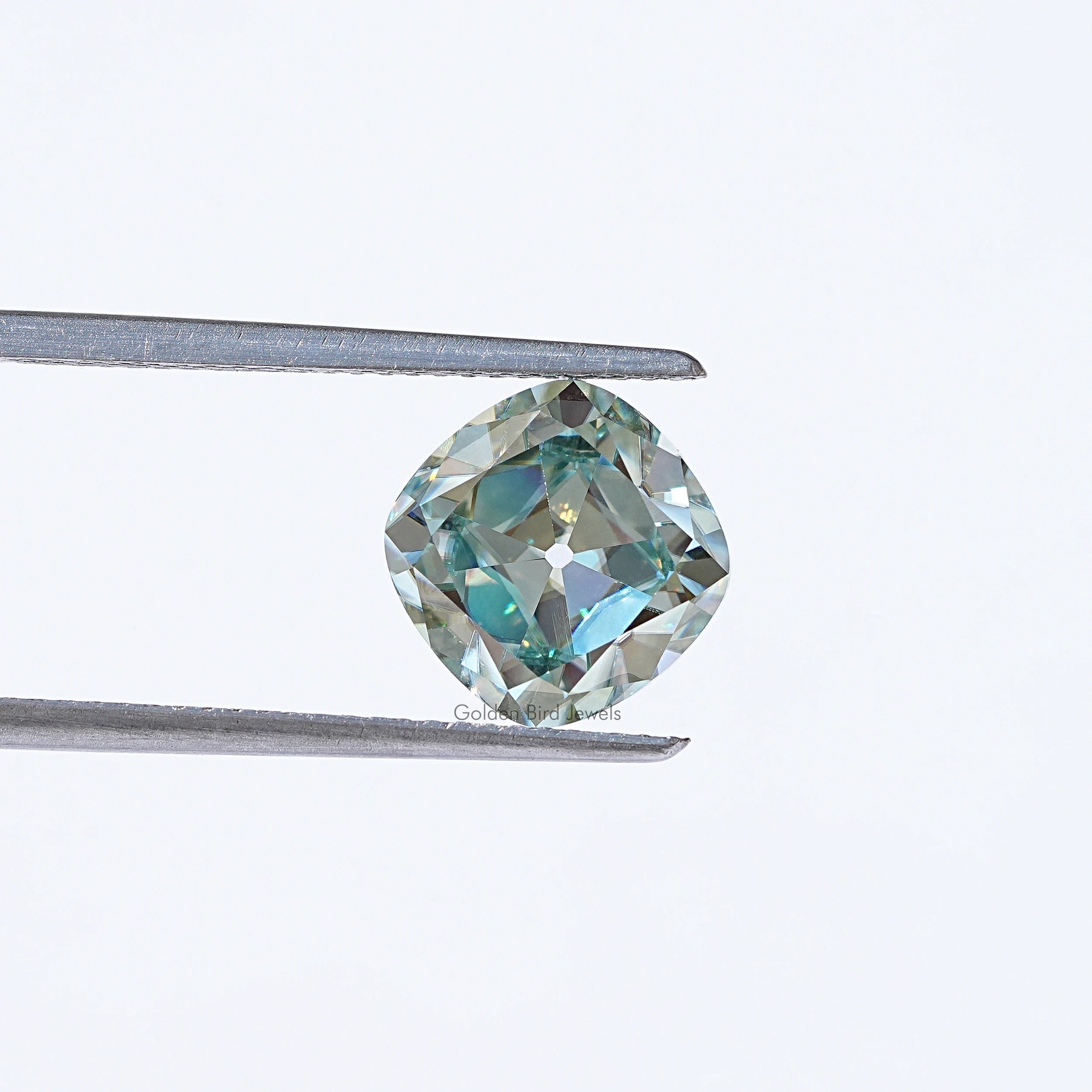 In Tweezer View Of Cushion Cut Loose Moissanite