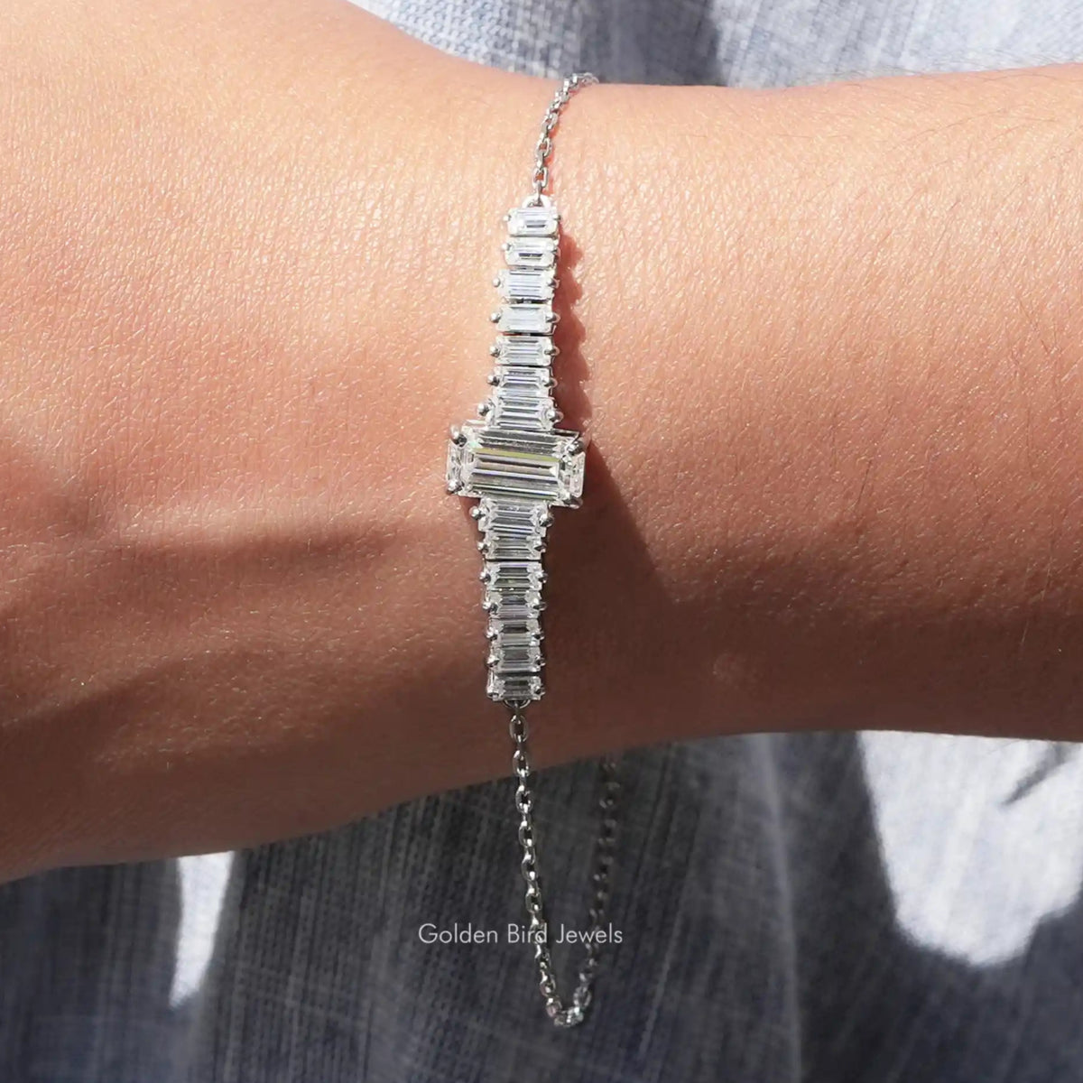 View of moissanite emerald cut with baguette tennis Bracelet