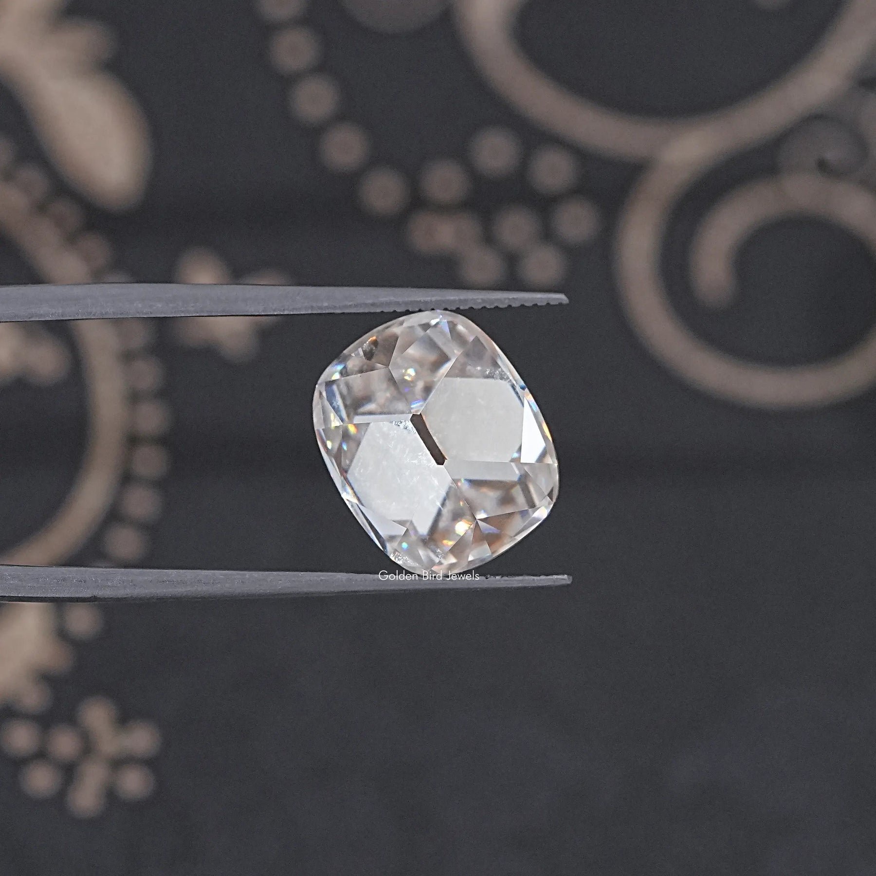 In Tweezer View Of Old Mine Cushion Cut Loose Moissanite Stone