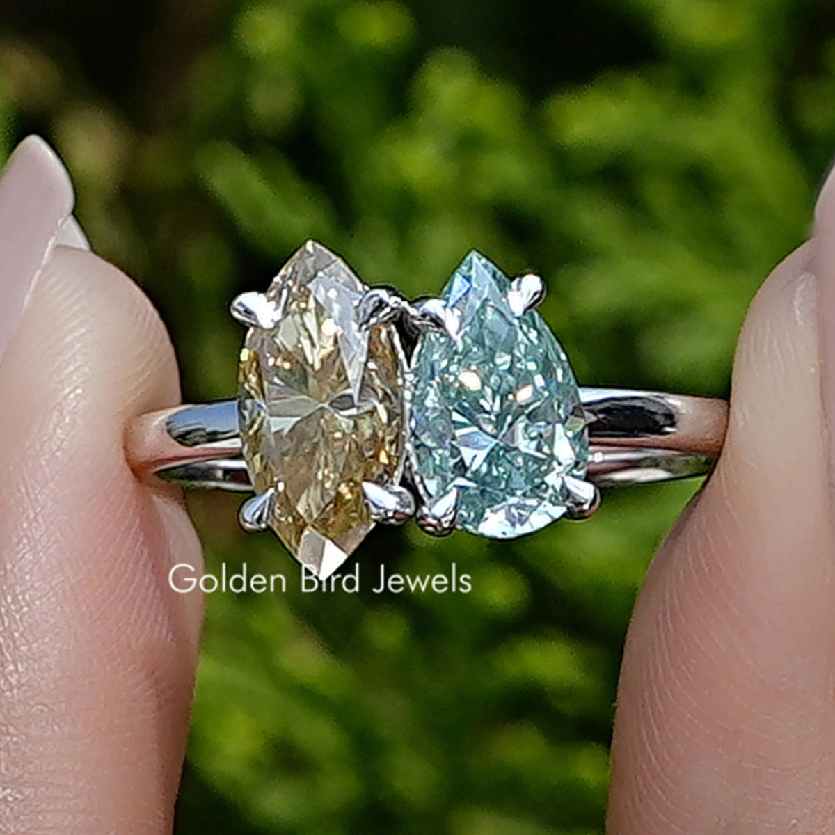 Front view of Marquise And Pear Cut Moissanite Toi Et Moi Ring