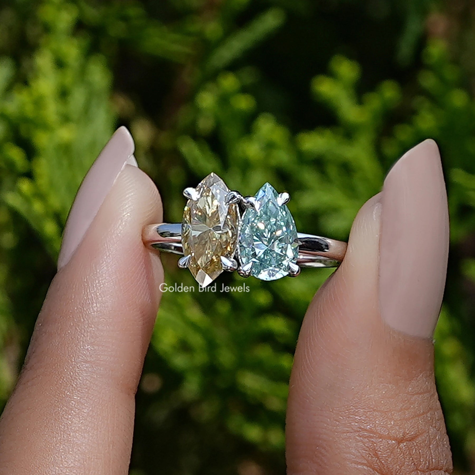 View of marquise and pear cut moissanite toi et moi Wedding Ring