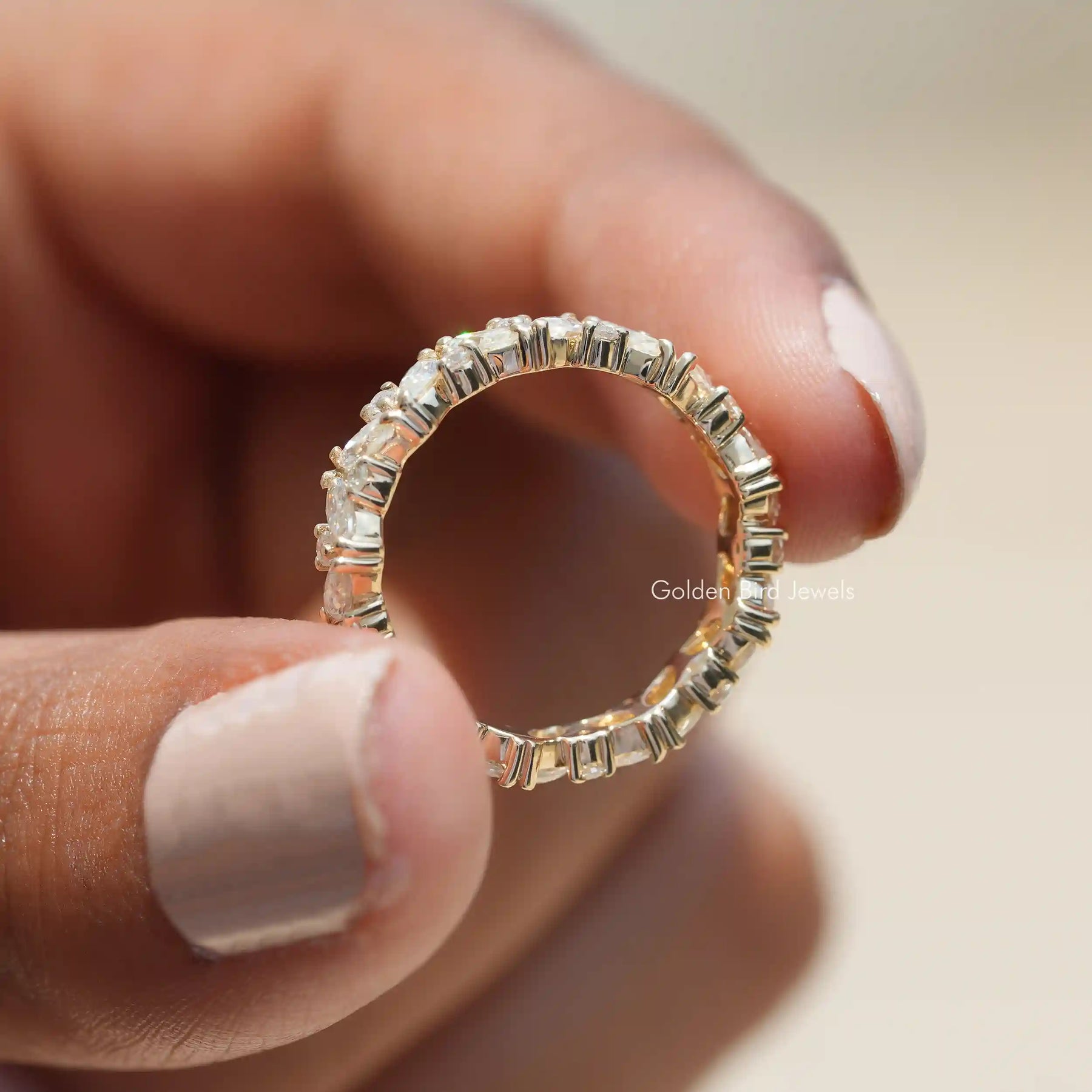 Back view of Marquise And Round Moissanite ring in secure setting