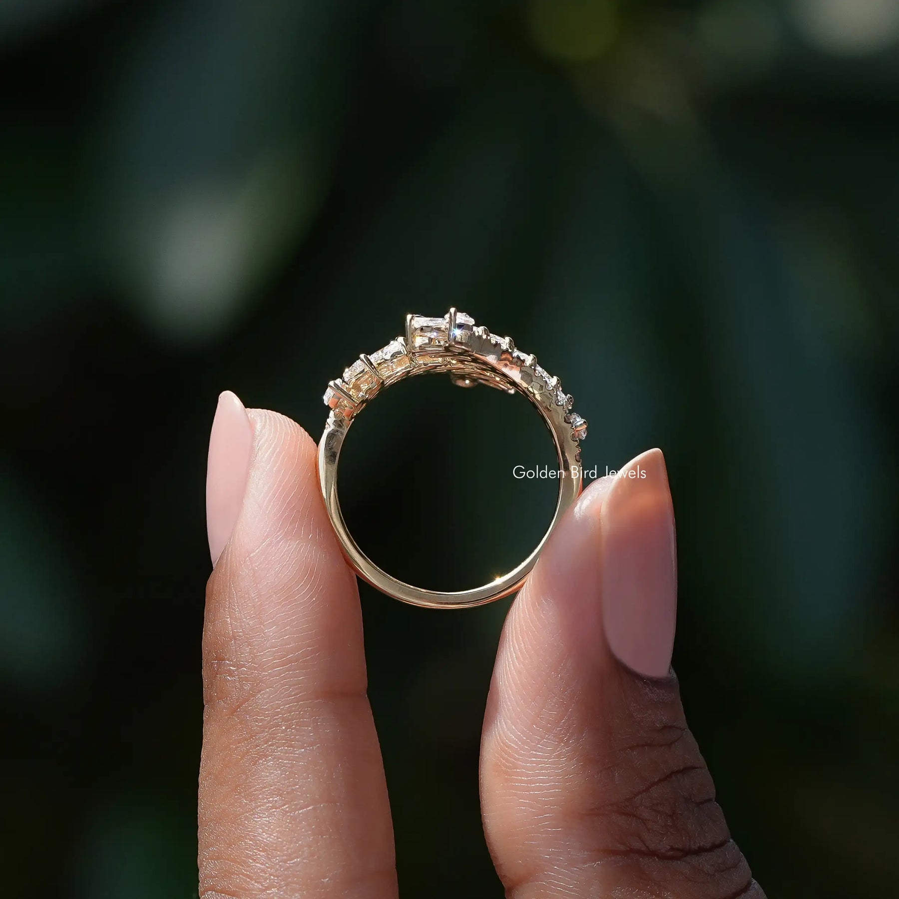 Back View of Marquise Cut Bypass Set Diamond Ring In two fingers