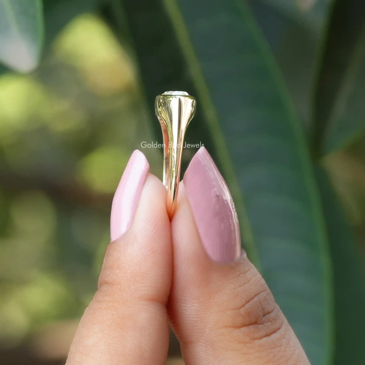 Side view of moissanite Weeding ring in holding two fingers