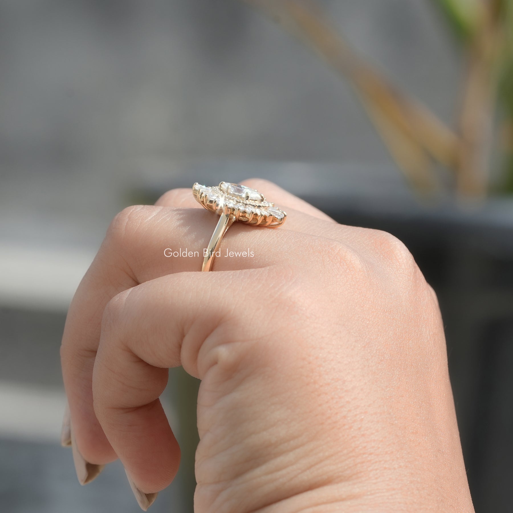Side View of Marquise Cut Halo Diamond Ballerina Ring In finger