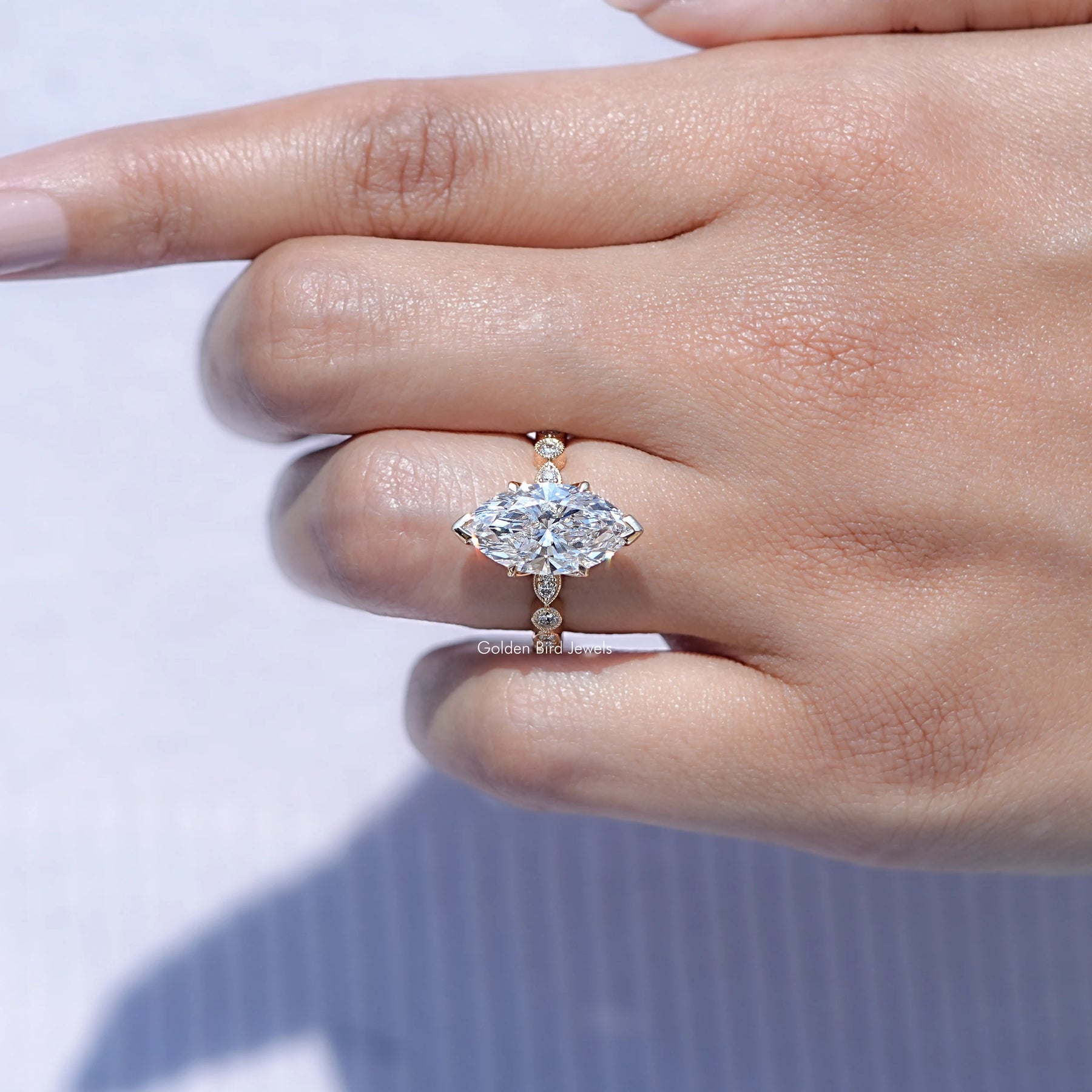In finger front view of Marquise Cut Lab Diamond ring in unique shape
